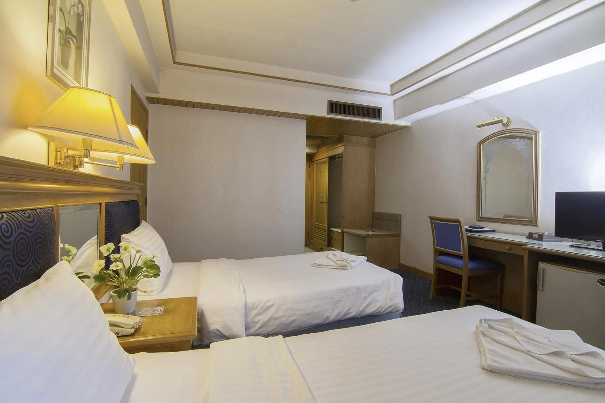 Bed in Bossotel Chiang Mai