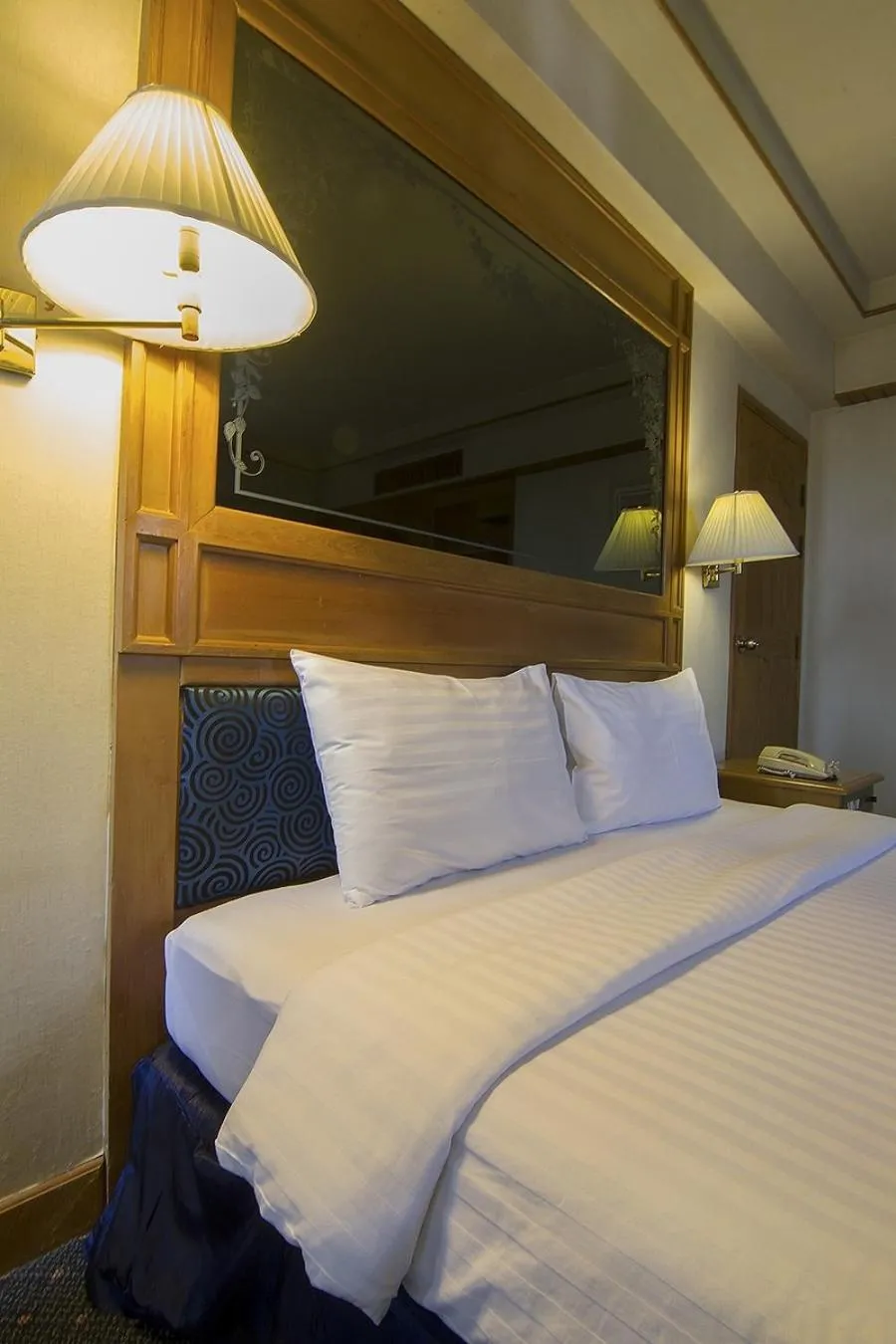 Bed in Bossotel Chiang Mai