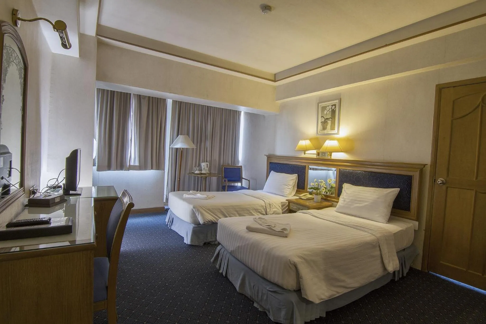 Bed in Bossotel Chiang Mai