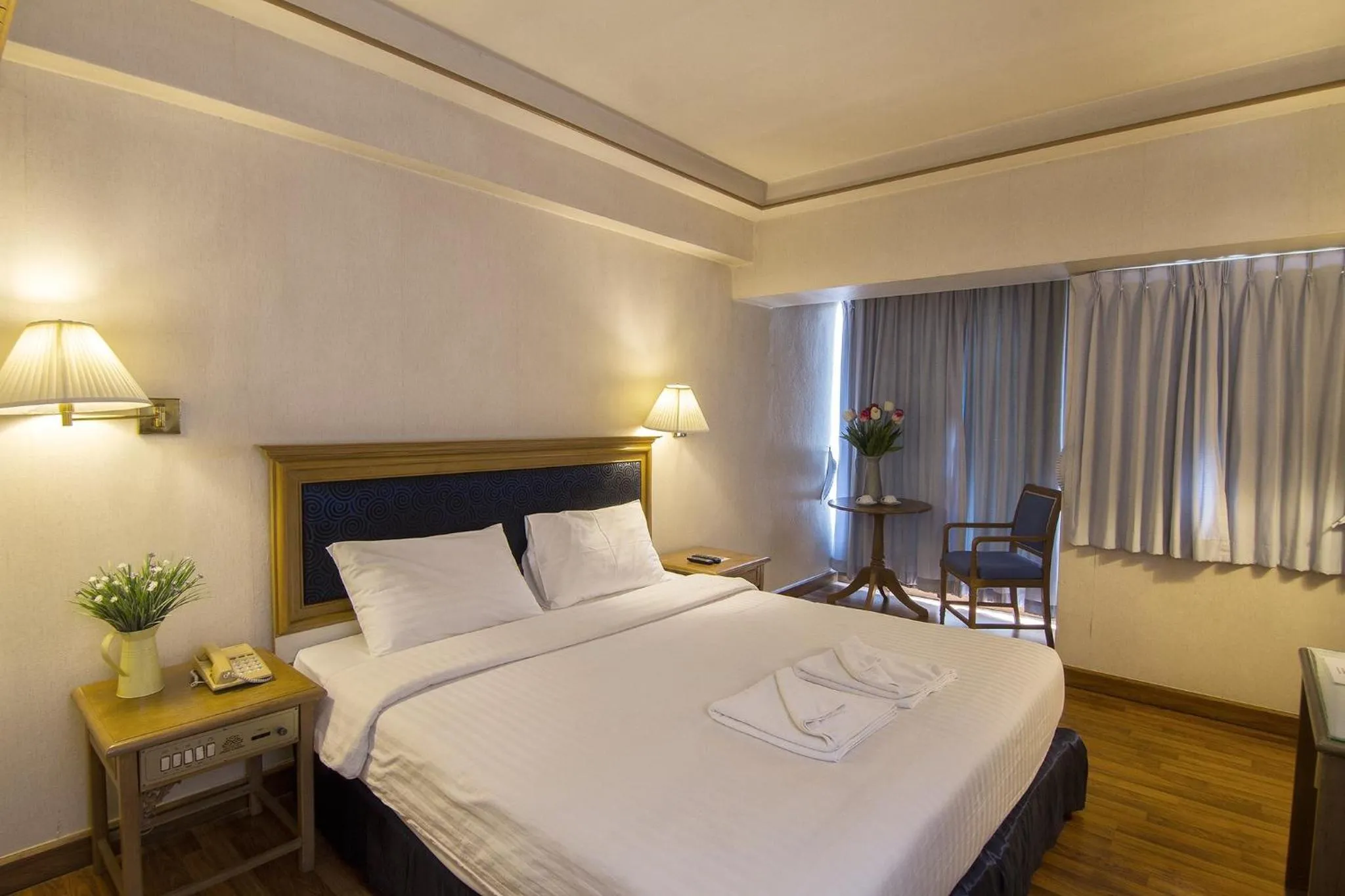 Bed in Bossotel Chiang Mai