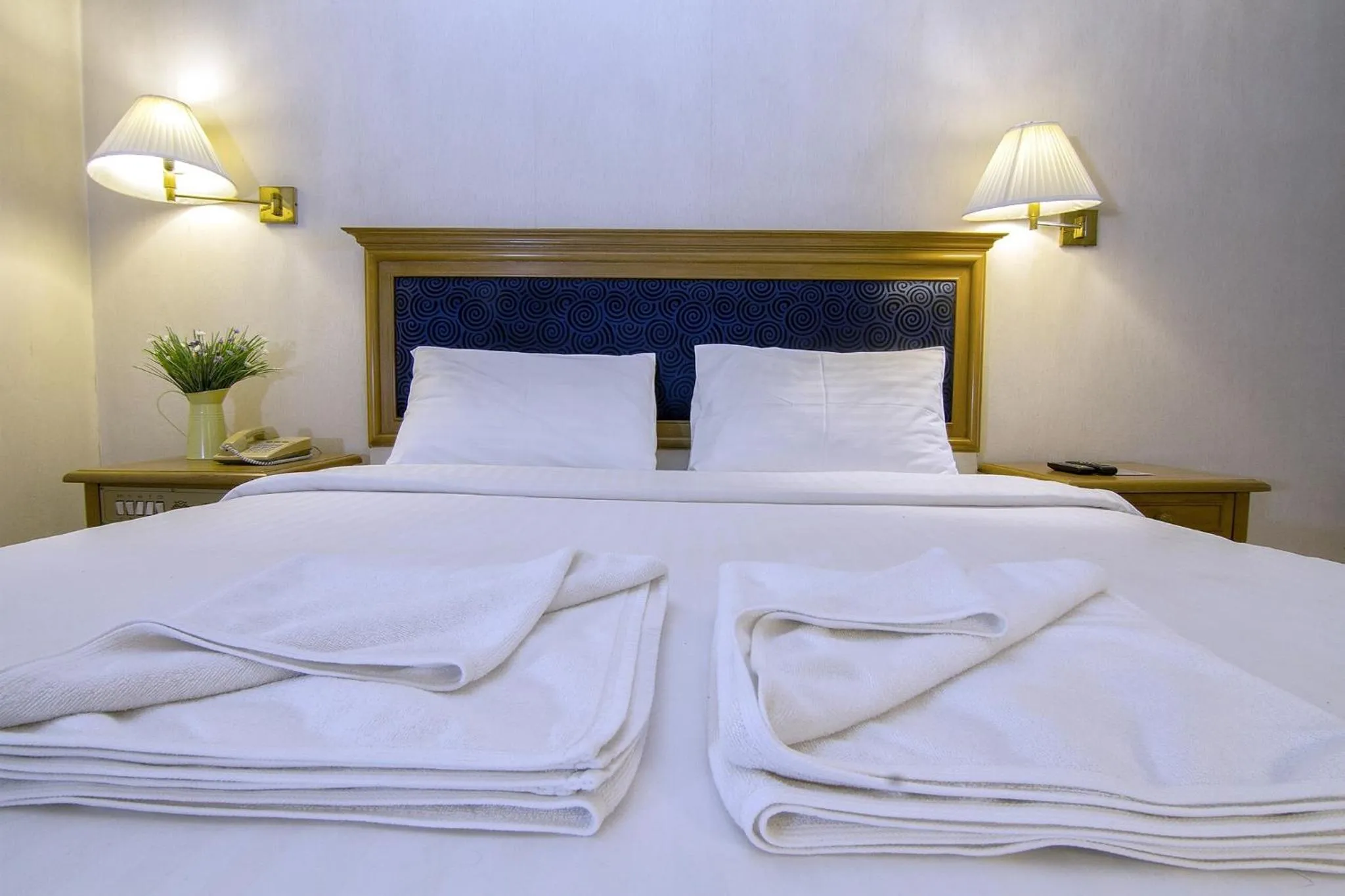 Bed in Bossotel Chiang Mai