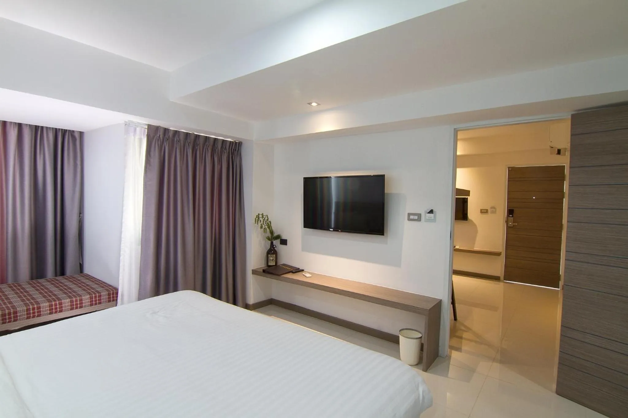 Bed in Bossotel Chiang Mai