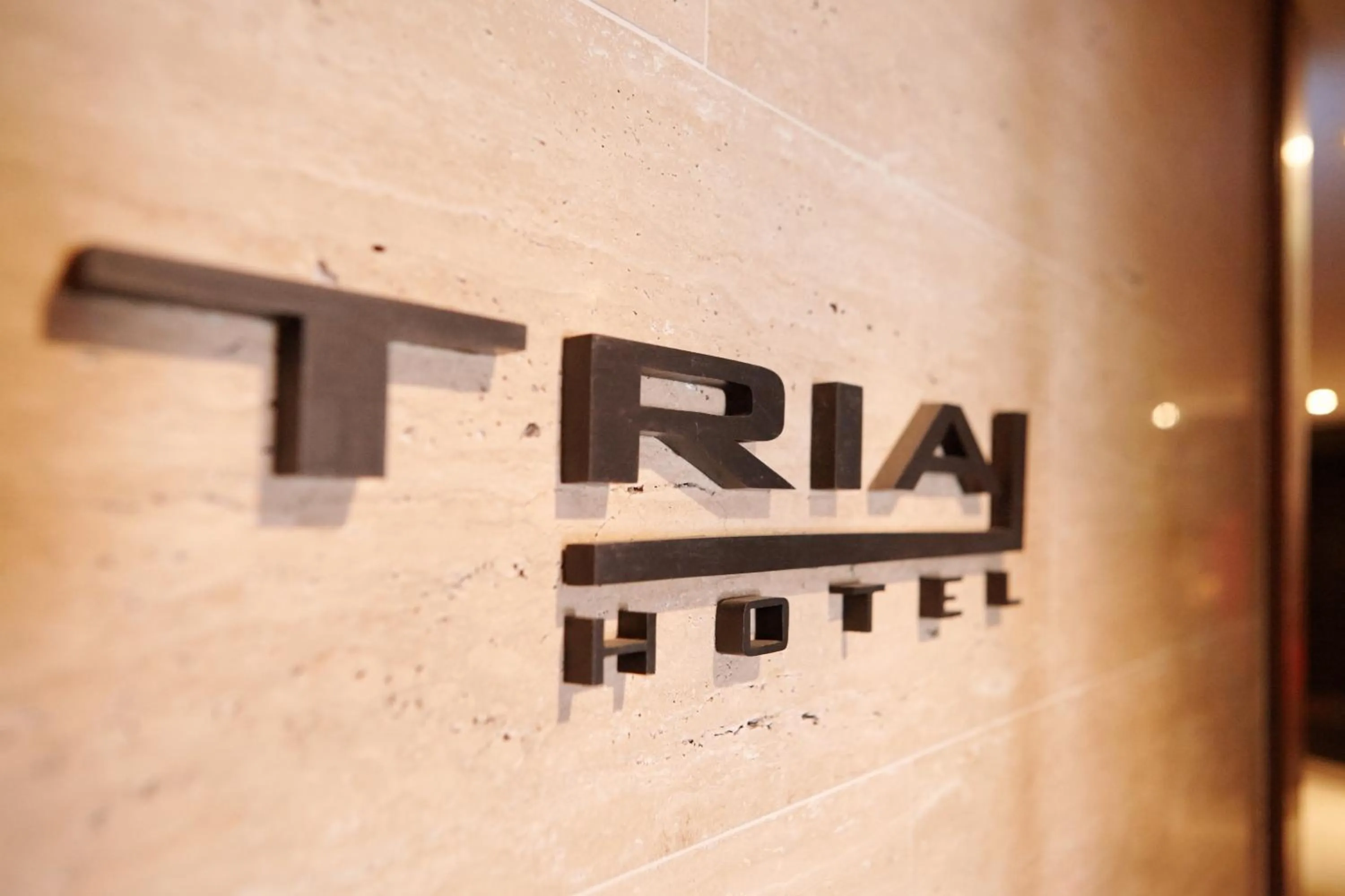 Property logo or sign in Tria Business & Boutique Hotel