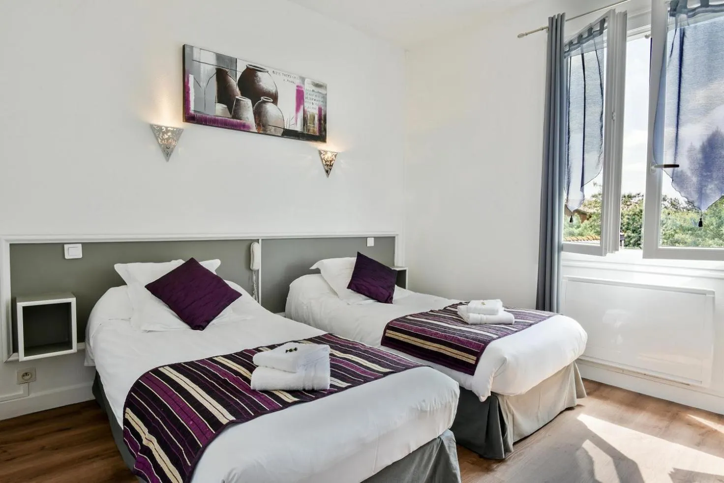 Bed in Logis Hôtel Emeraude des Bois