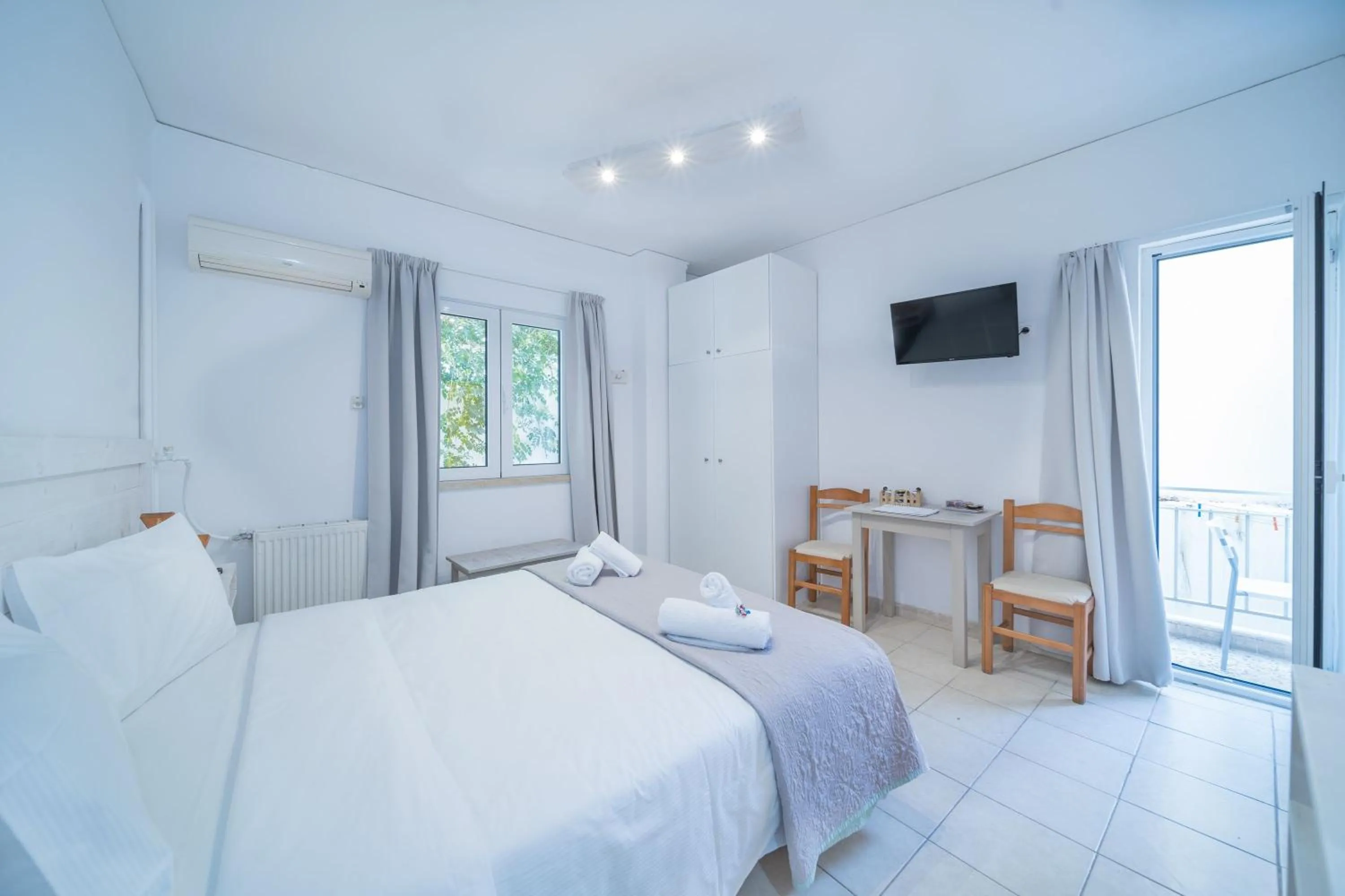 Bed in City Center Studios by Cretan Houses