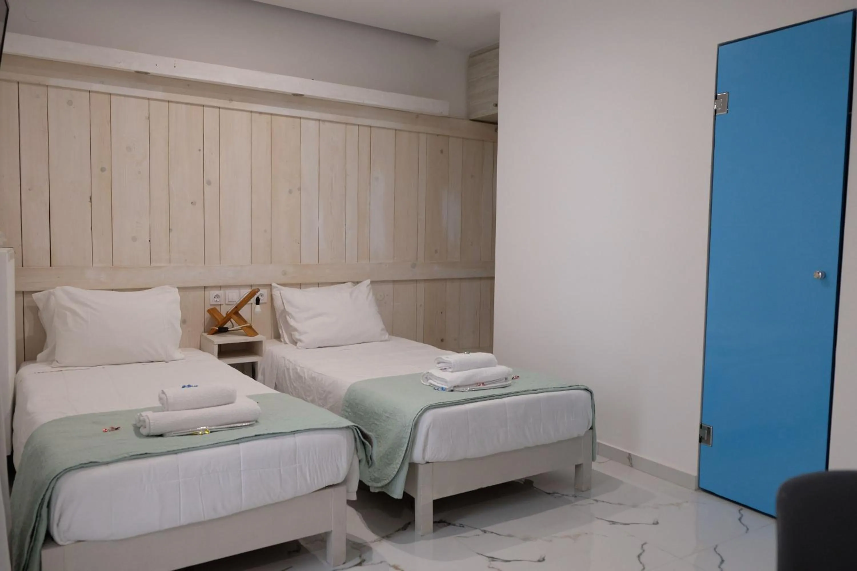 Bed in City Center Studios by Cretan Houses