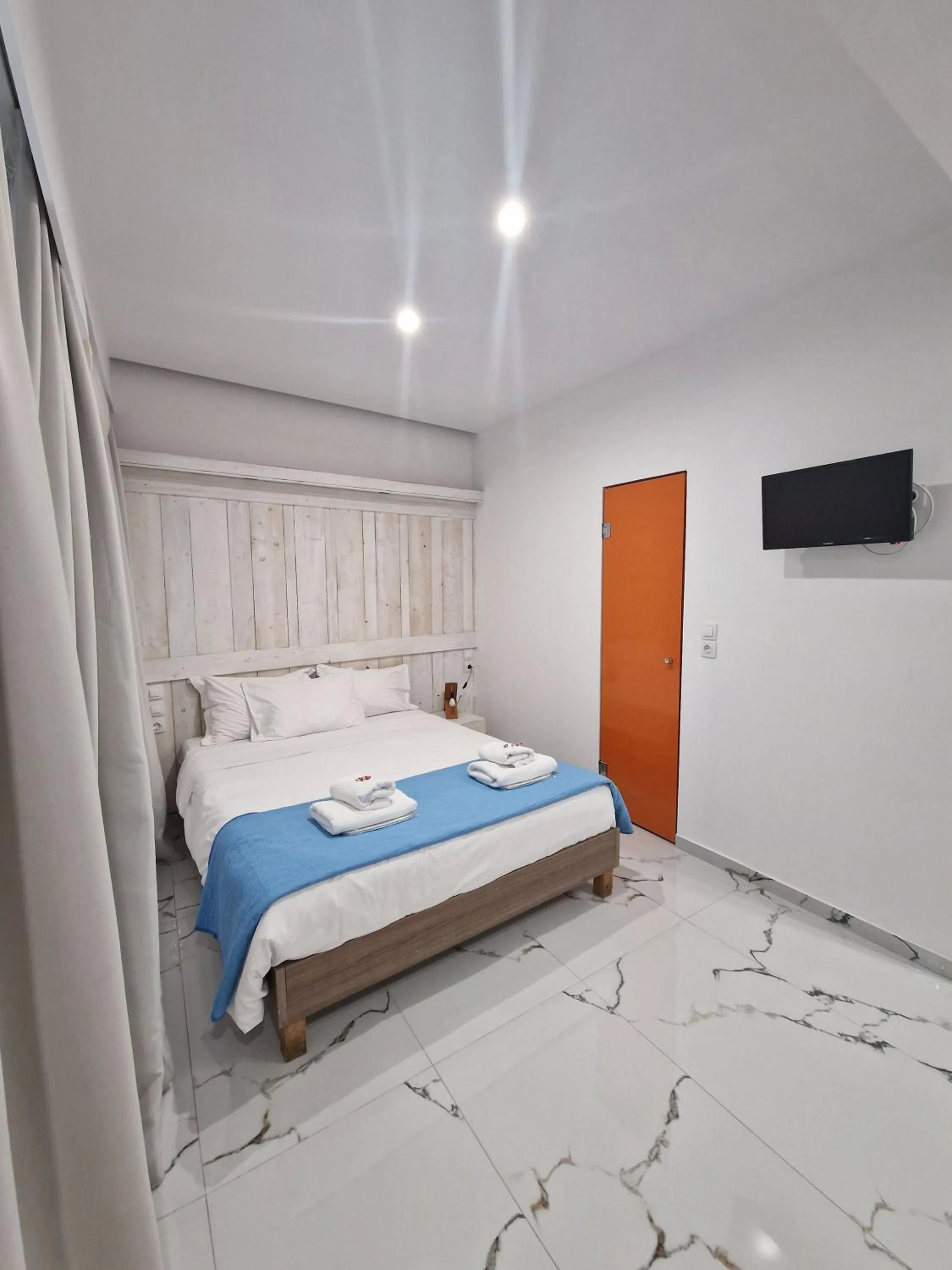 Bed in City Center Studios by Cretan Houses