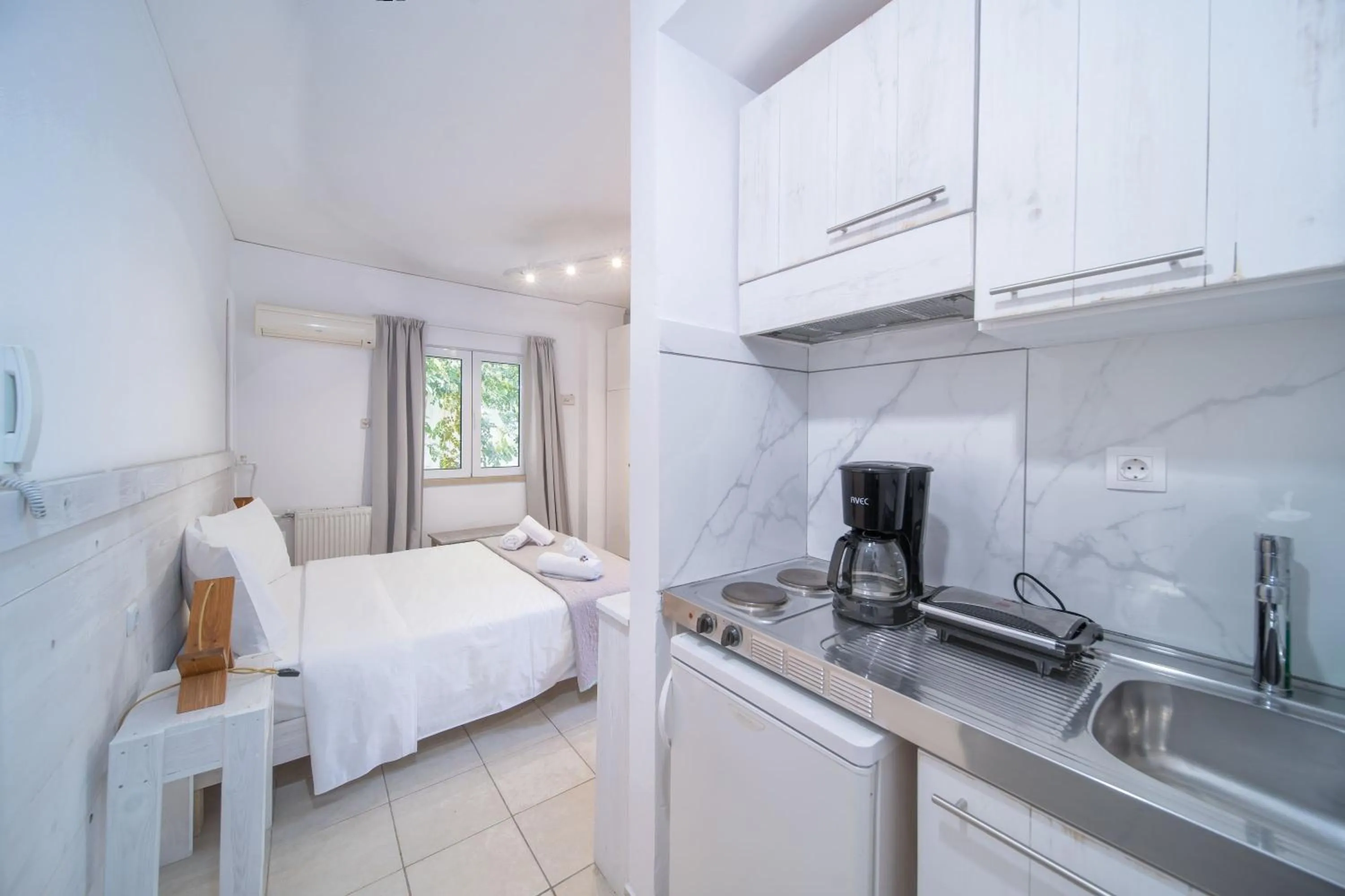 Bed in City Center Studios by Cretan Houses