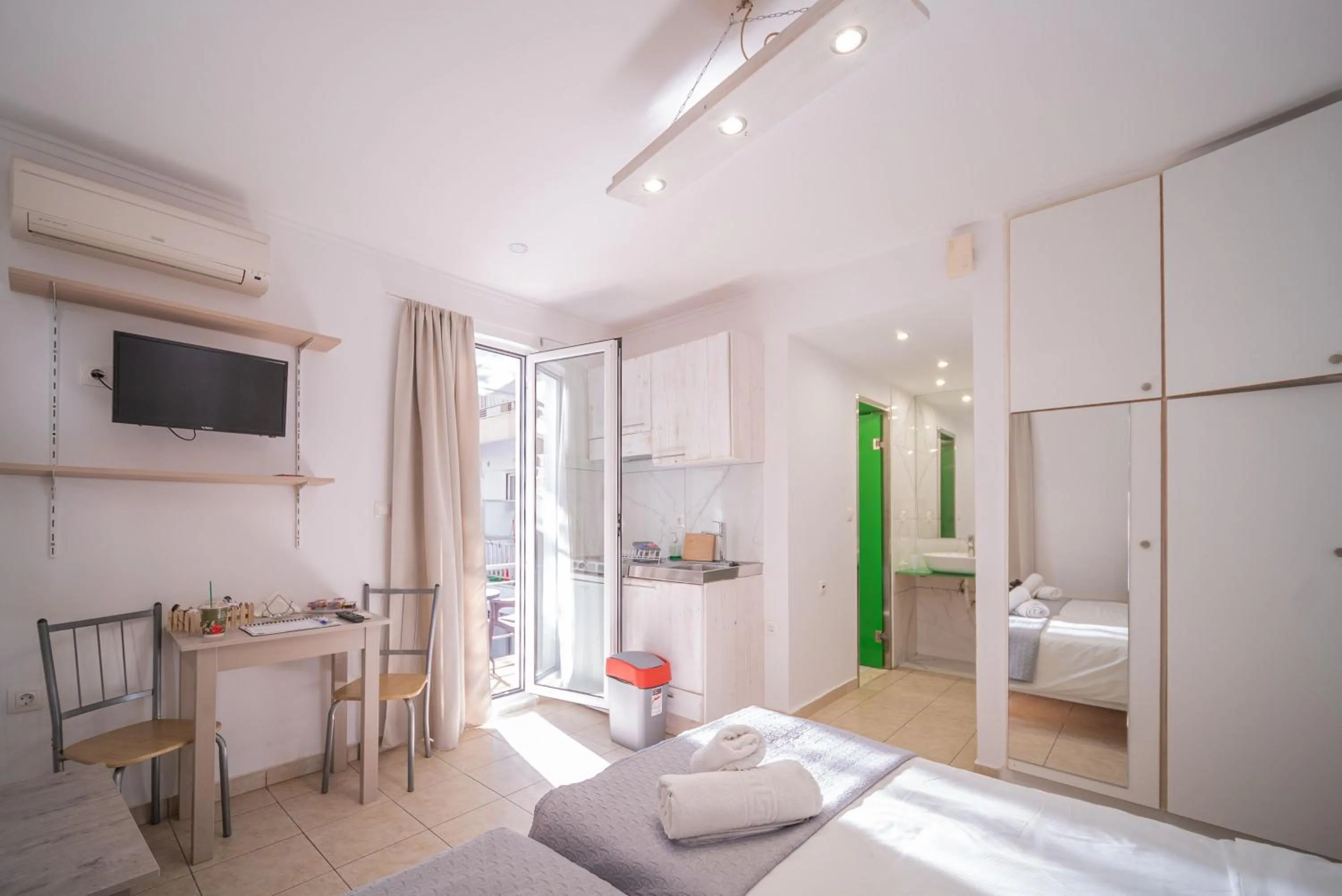 Bed in City Center Studios by Cretan Houses