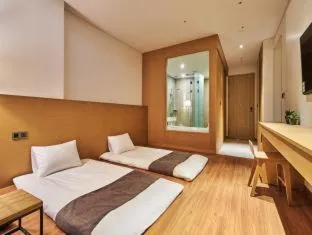 Bed in Naksan Beach Hotel