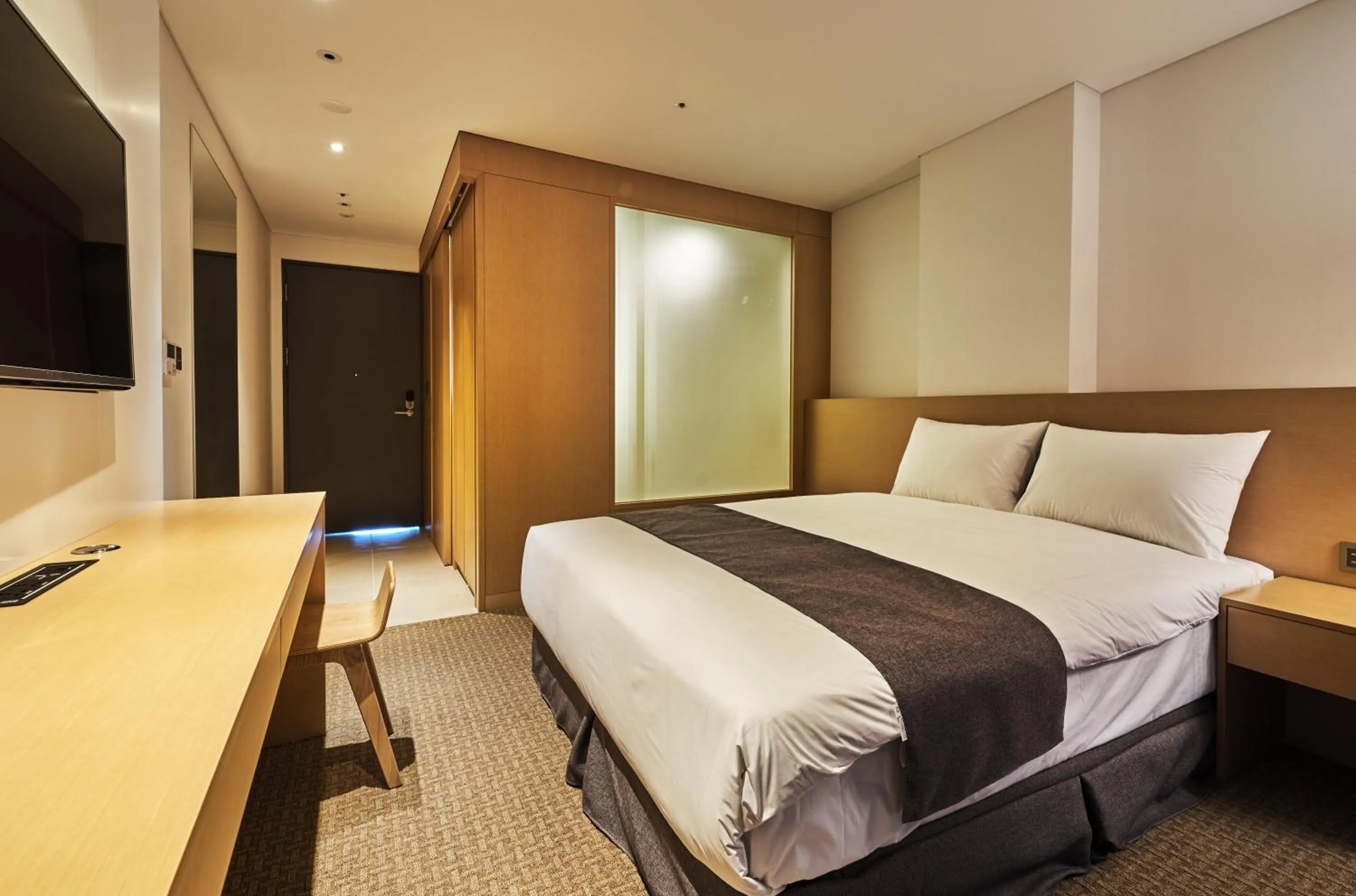 Bed in Naksan Beach Hotel