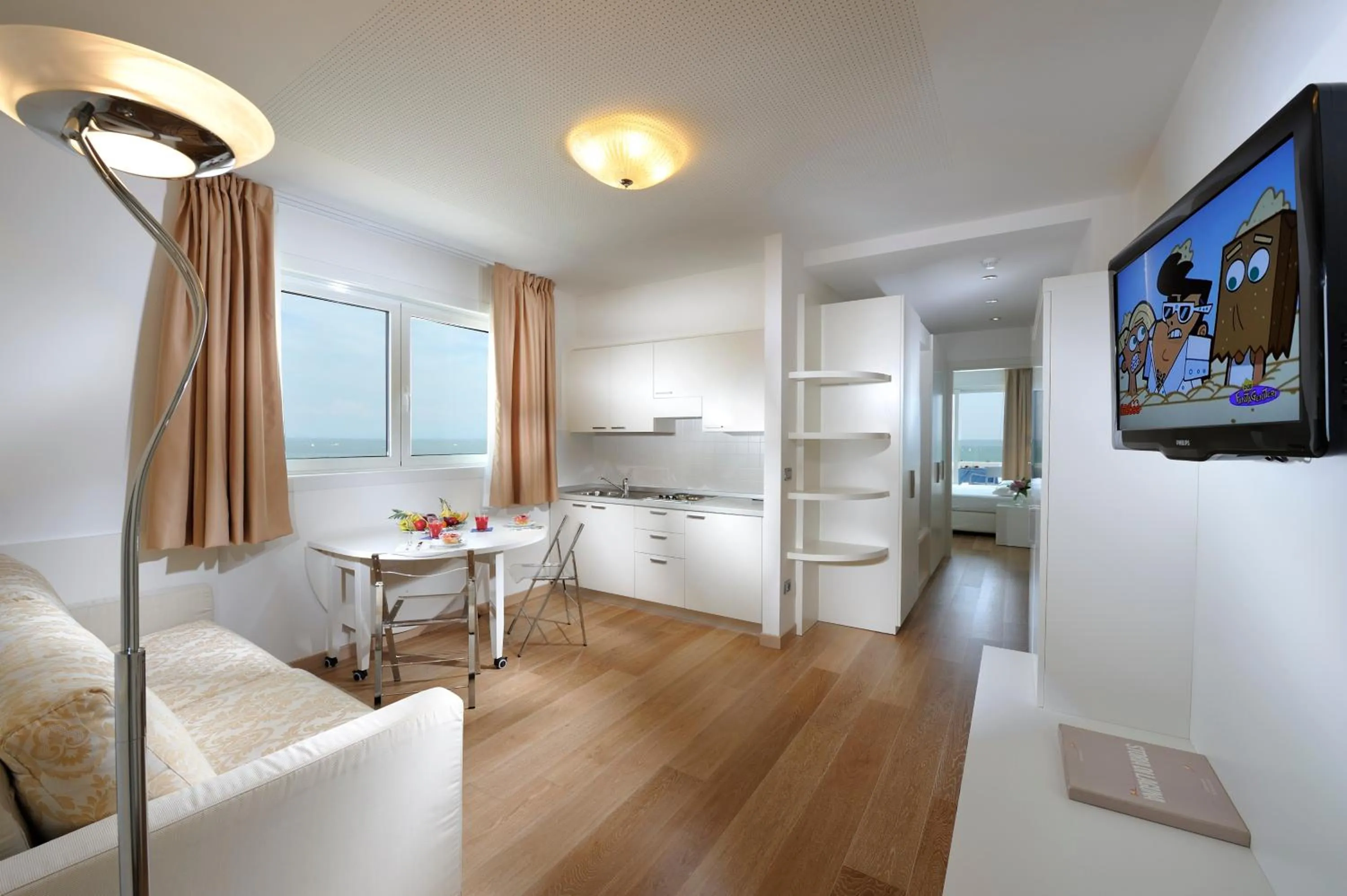 Living room, Bed in Grand Hotel Playa