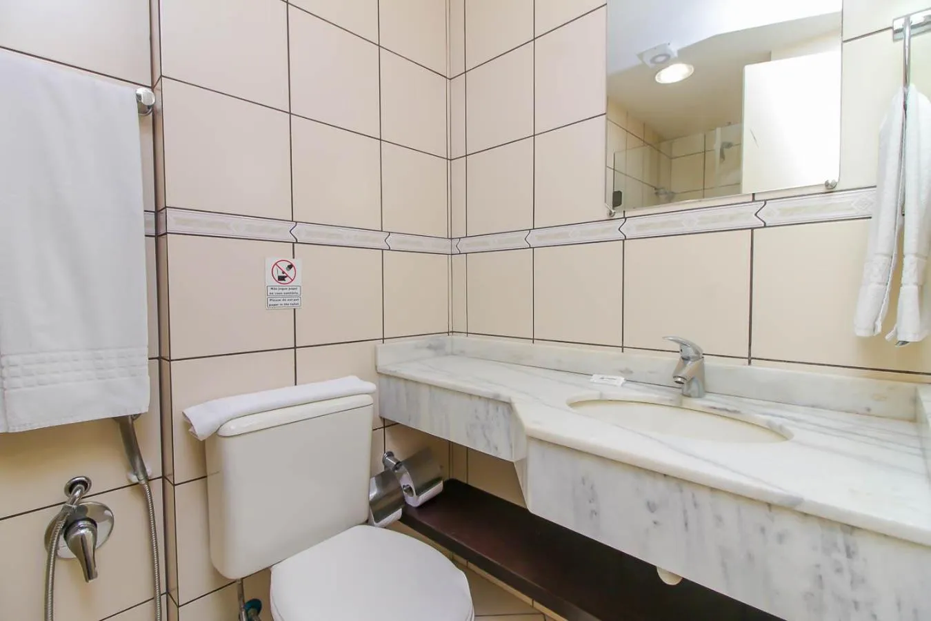 Toilet in Coral Trade Hotel