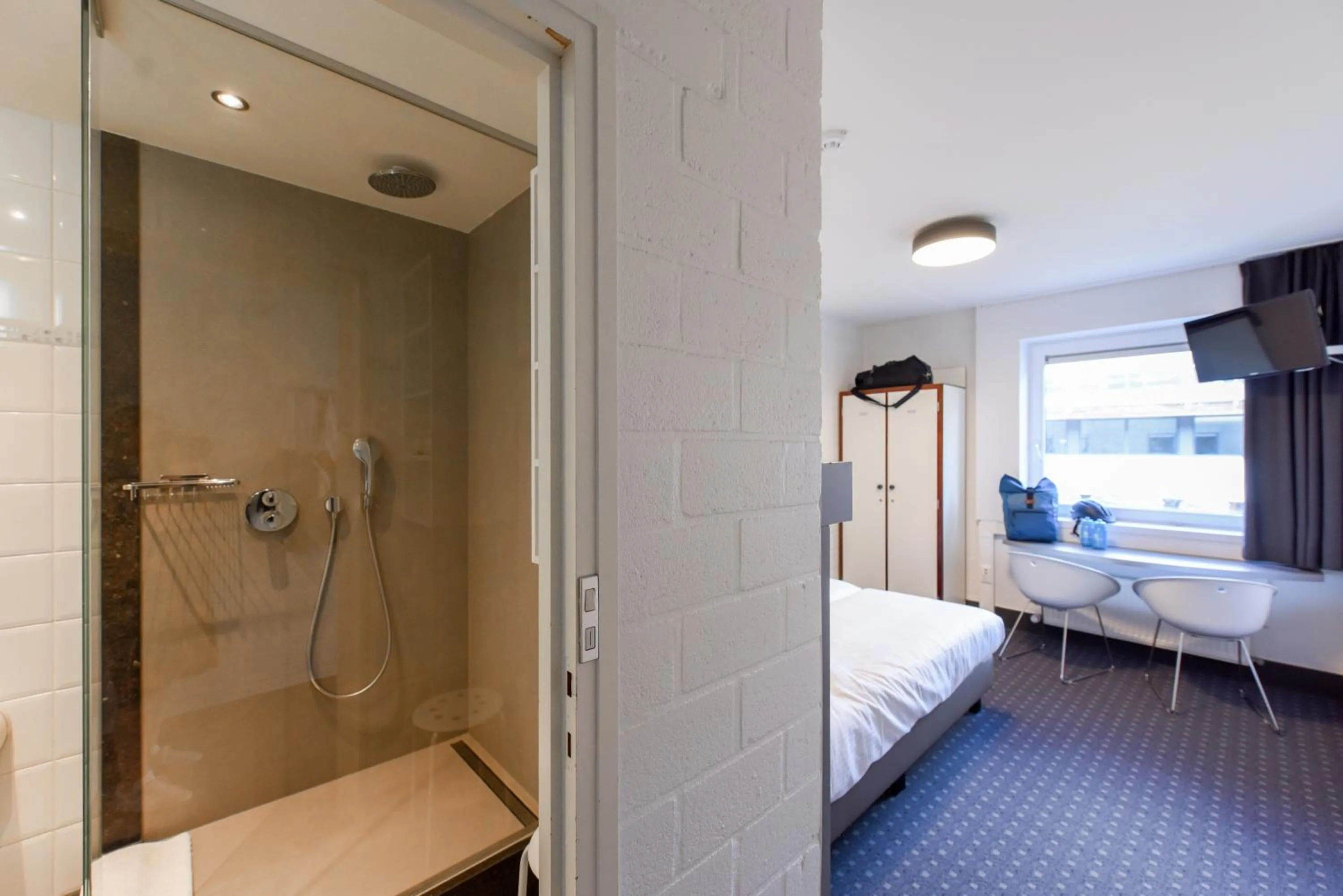 Shower, Bed in Vakantiedomein Hoge Duin