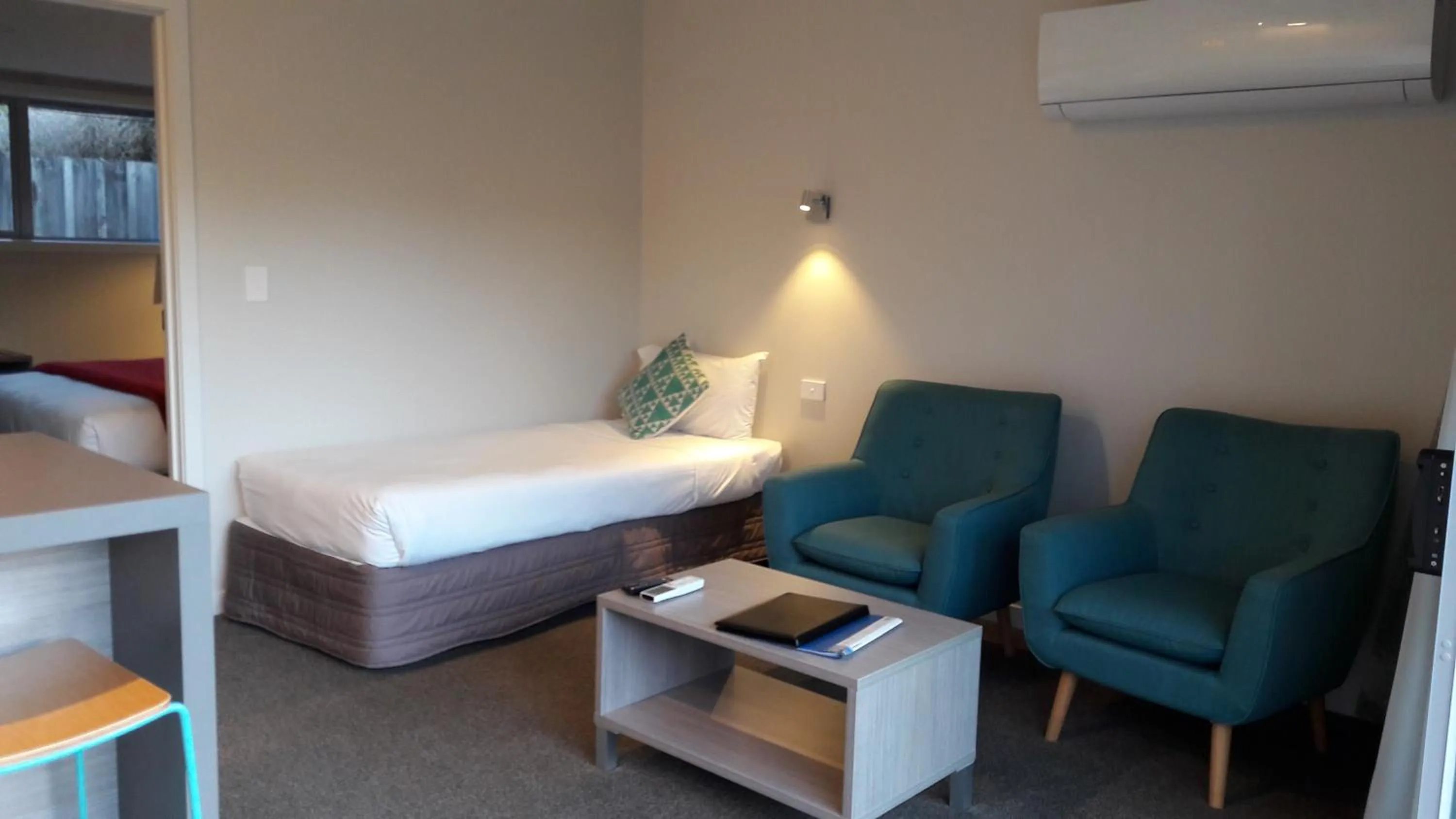 Bed in Edgewater Motel