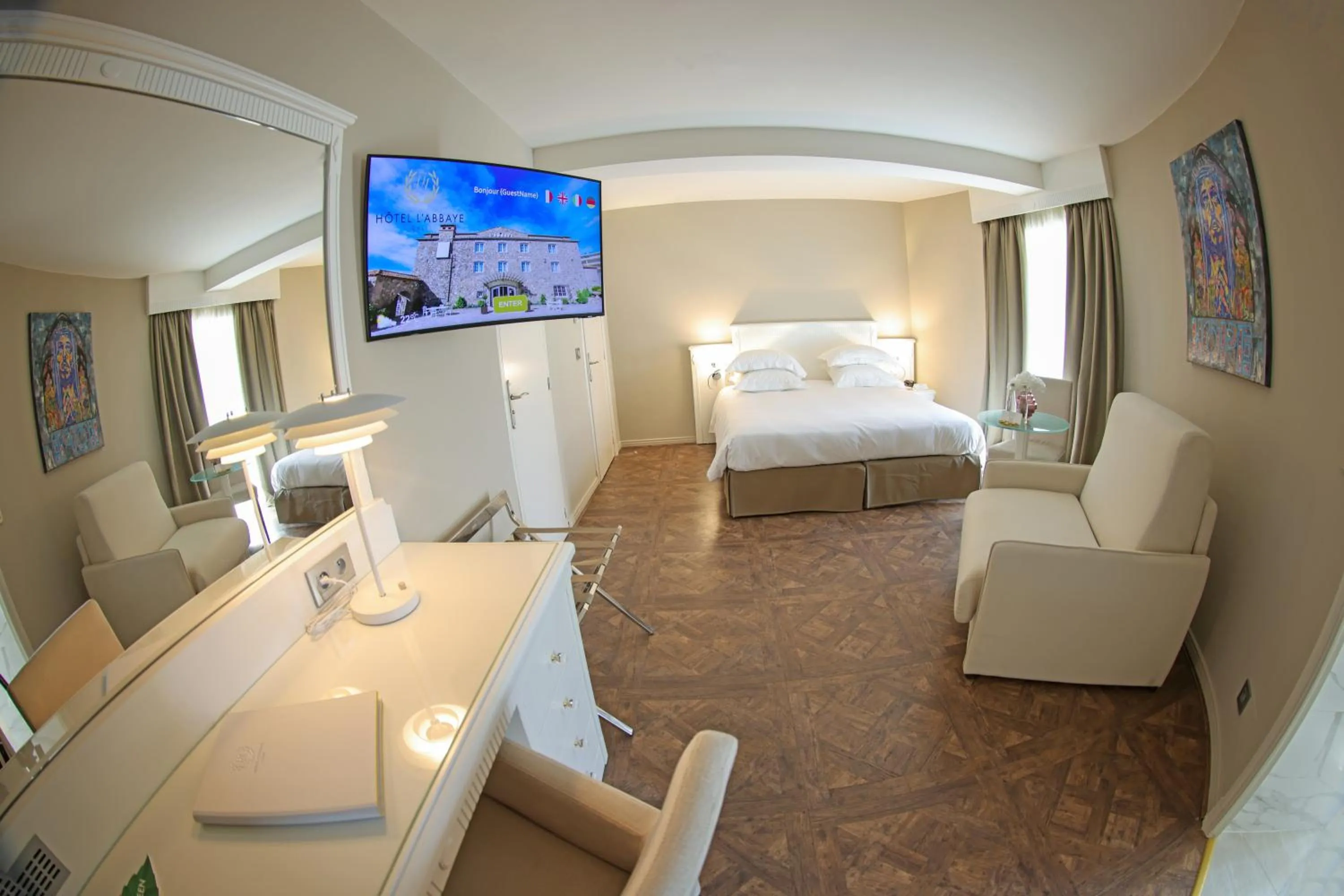 Communal lounge/ TV room, Bed in Hôtel L'Abbaye