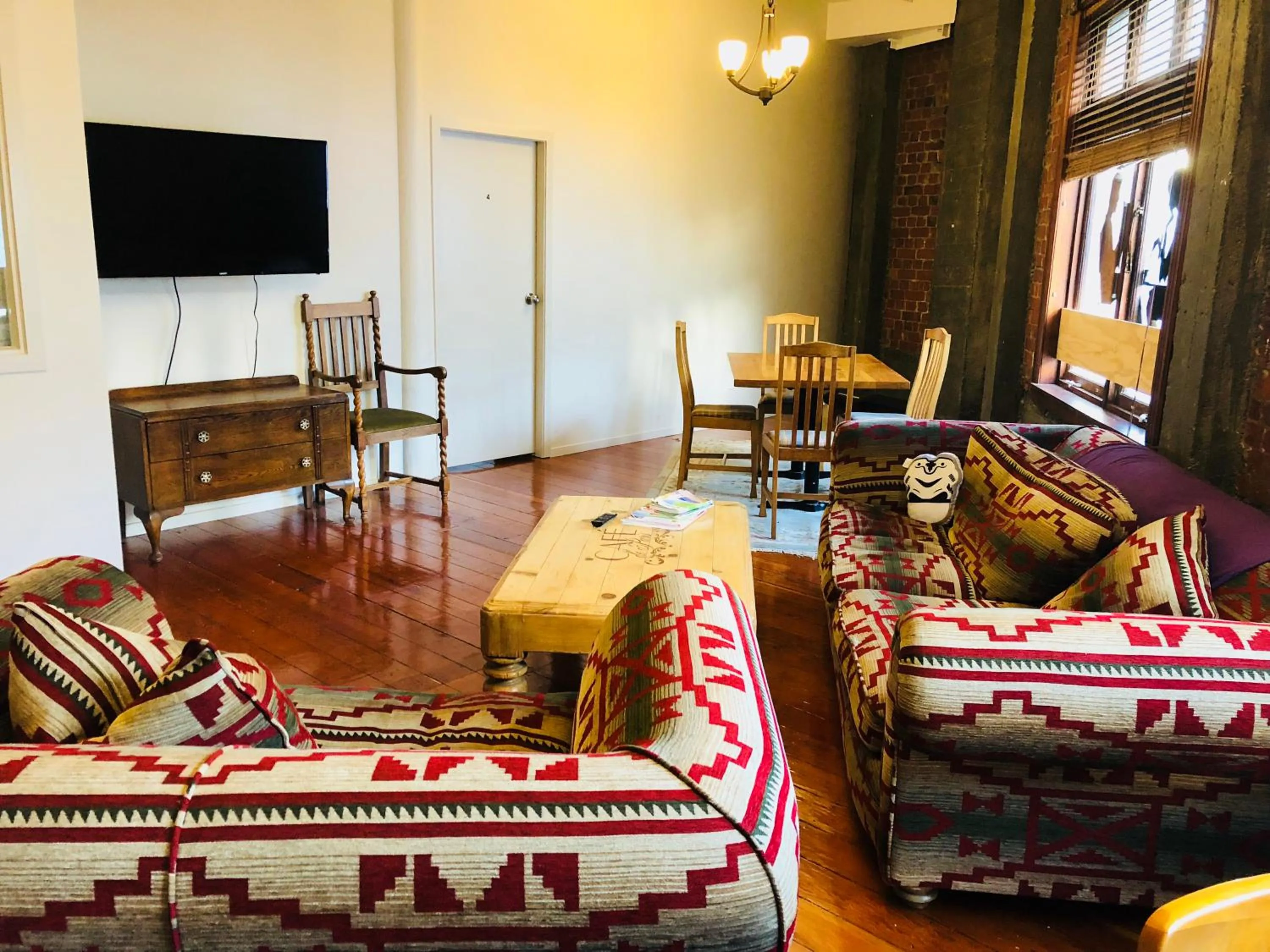 Communal lounge/ TV room in Aura Hotel