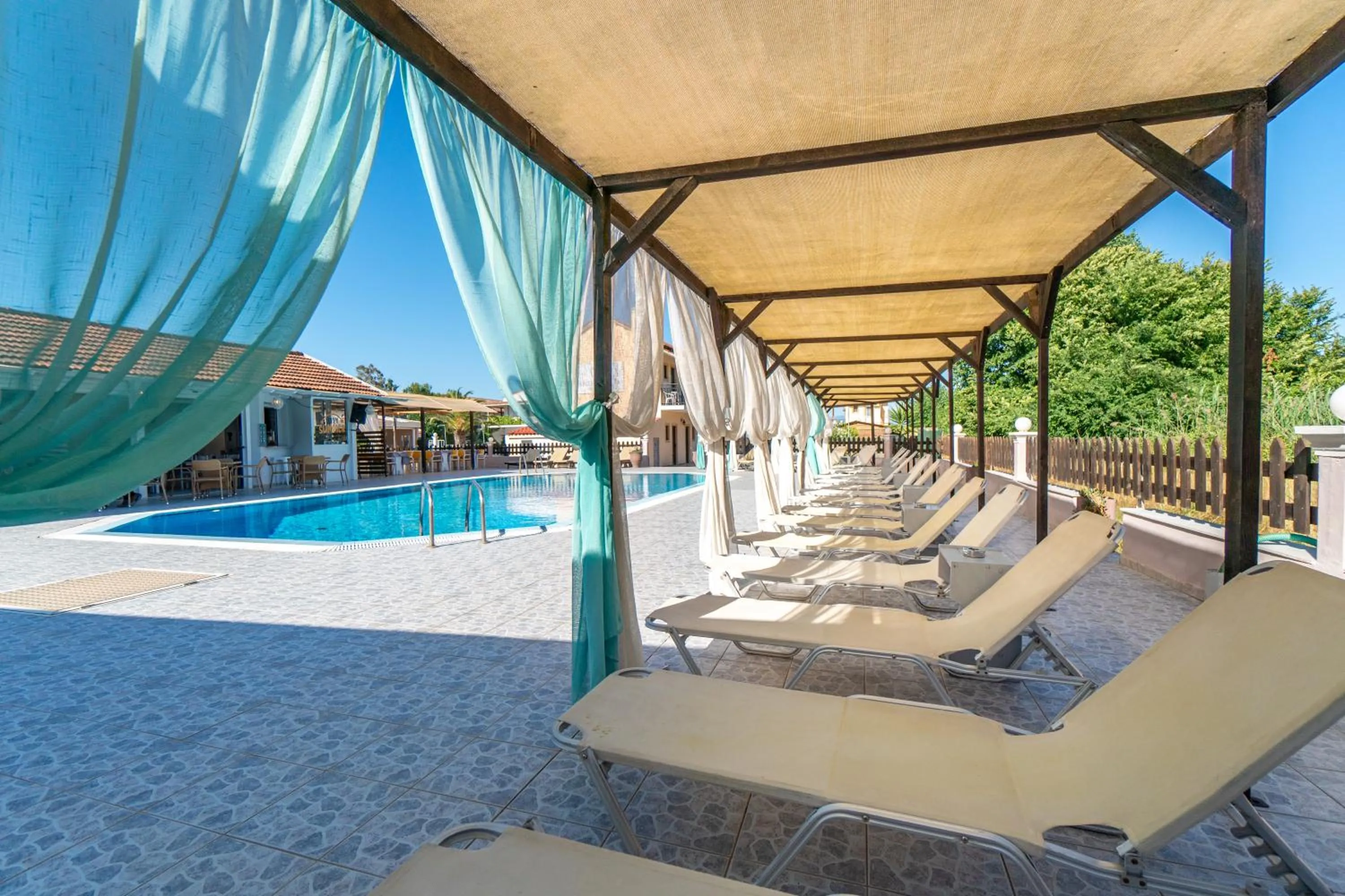 Day in Sandy Beach Complex - Poolside Studios & Seaside Apartments