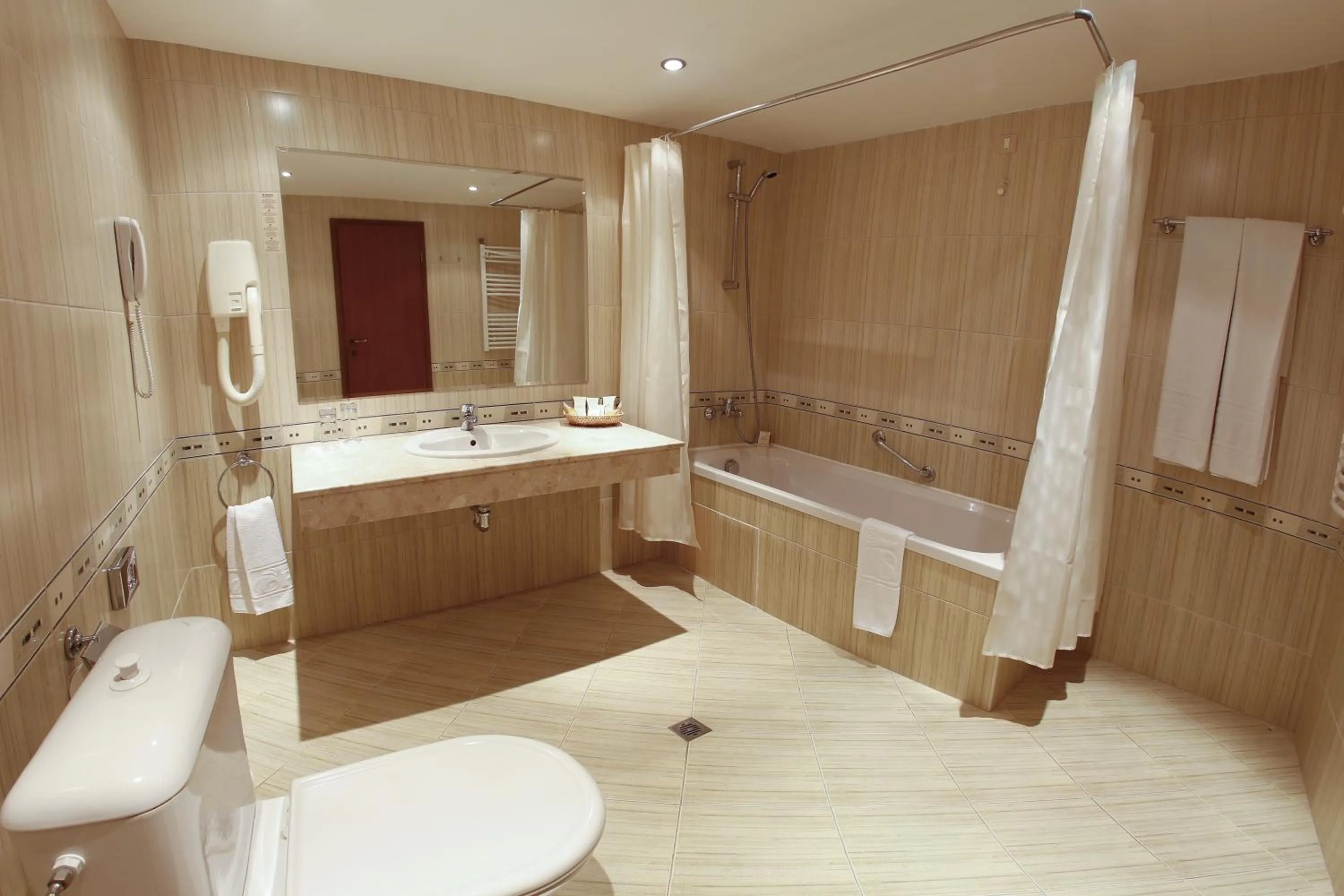 Bathroom in HVD Lotos Hotel - All Inclusive à-la-carte, Private Beach & Free Parking