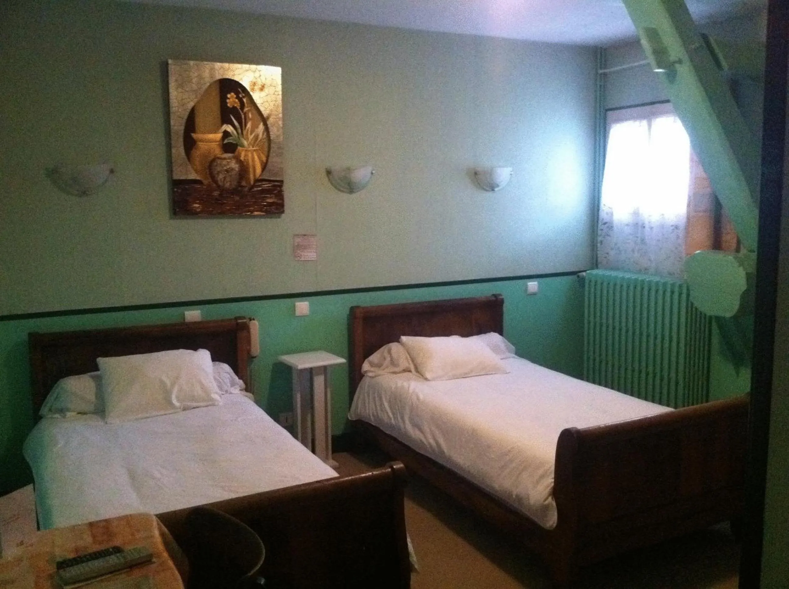 Photo of the whole room, Bed in Logis Hostellerie Du Cheval Blanc