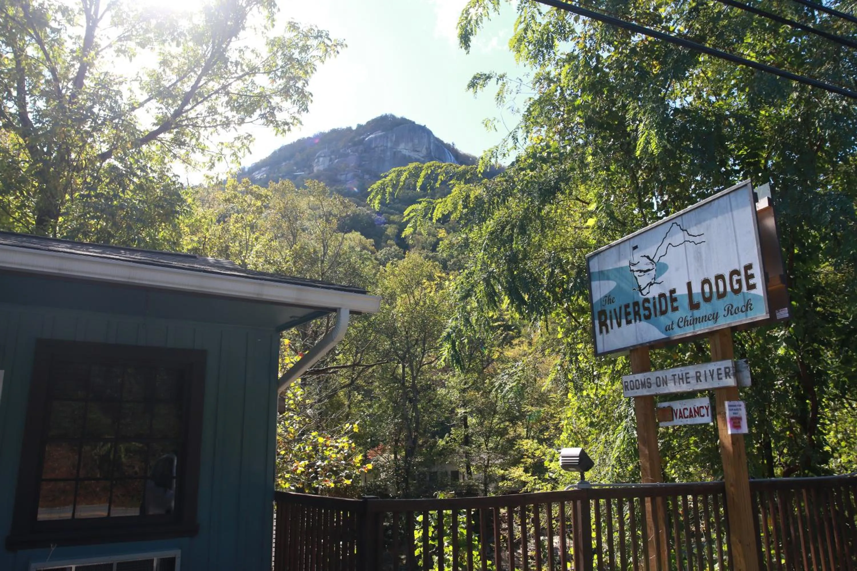 Property logo or sign in Riverside Lodge at Chimney Rock