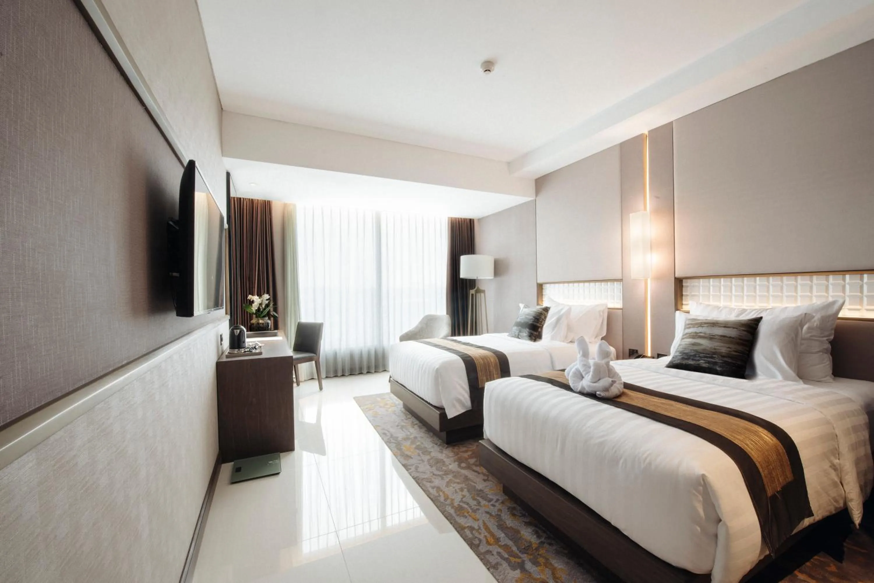 Bed in GRAMM HOTEL by Ambarrukmo Yogyakarta
