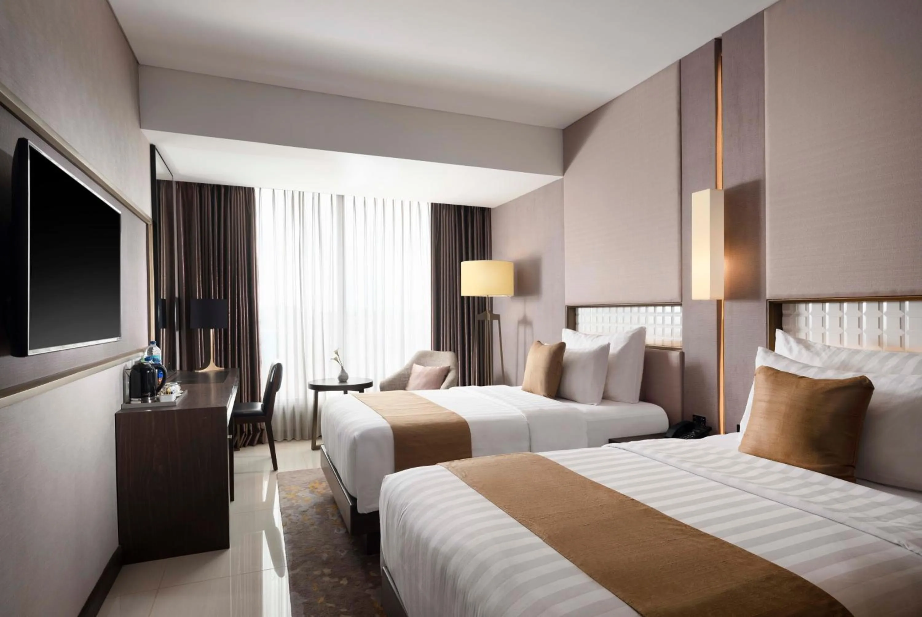 Bed in GRAMM HOTEL by Ambarrukmo Yogyakarta