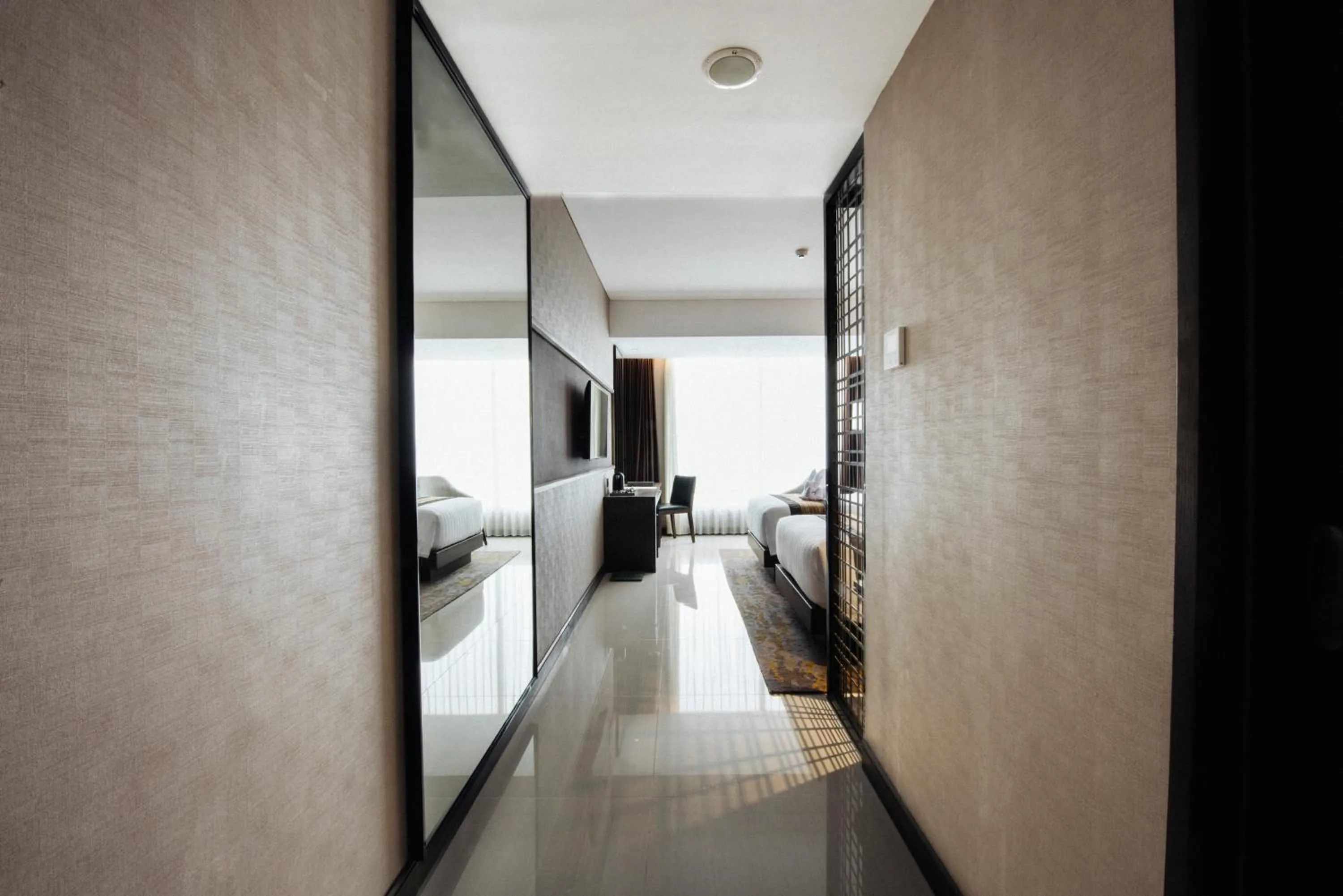 Bed in GRAMM HOTEL by Ambarrukmo Yogyakarta