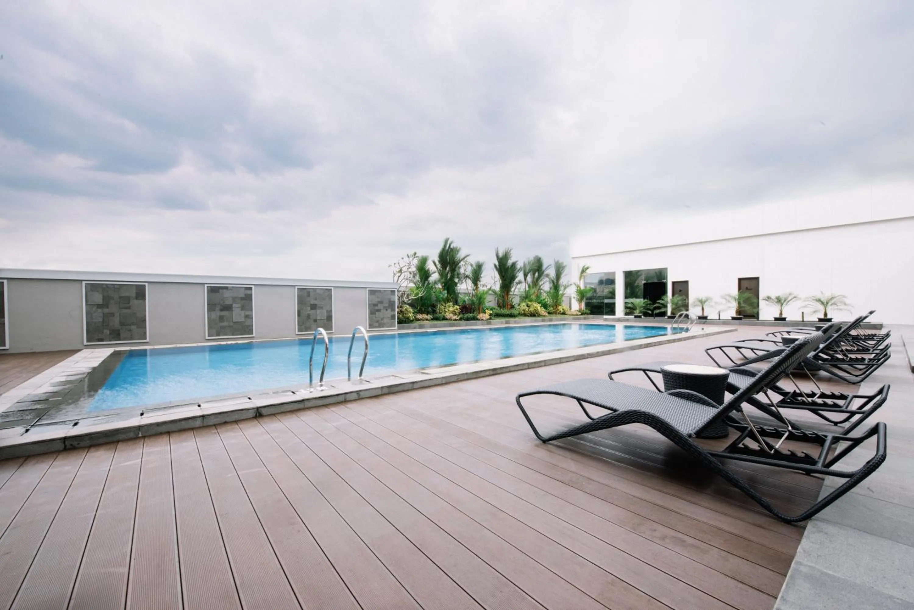 Swimming pool in GRAMM HOTEL by Ambarrukmo Yogyakarta