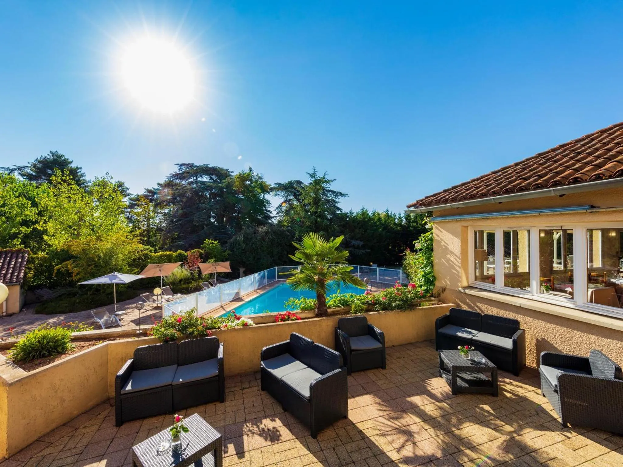 Swimming pool in Logis Hotel Noemys Morgon