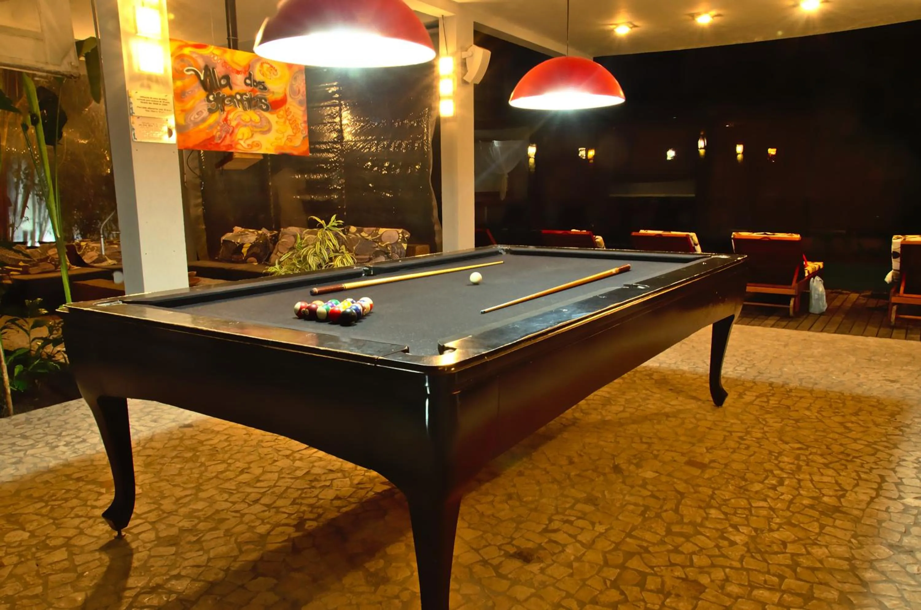 Communal lounge/ TV room in Villa dos Graffitis Pousada