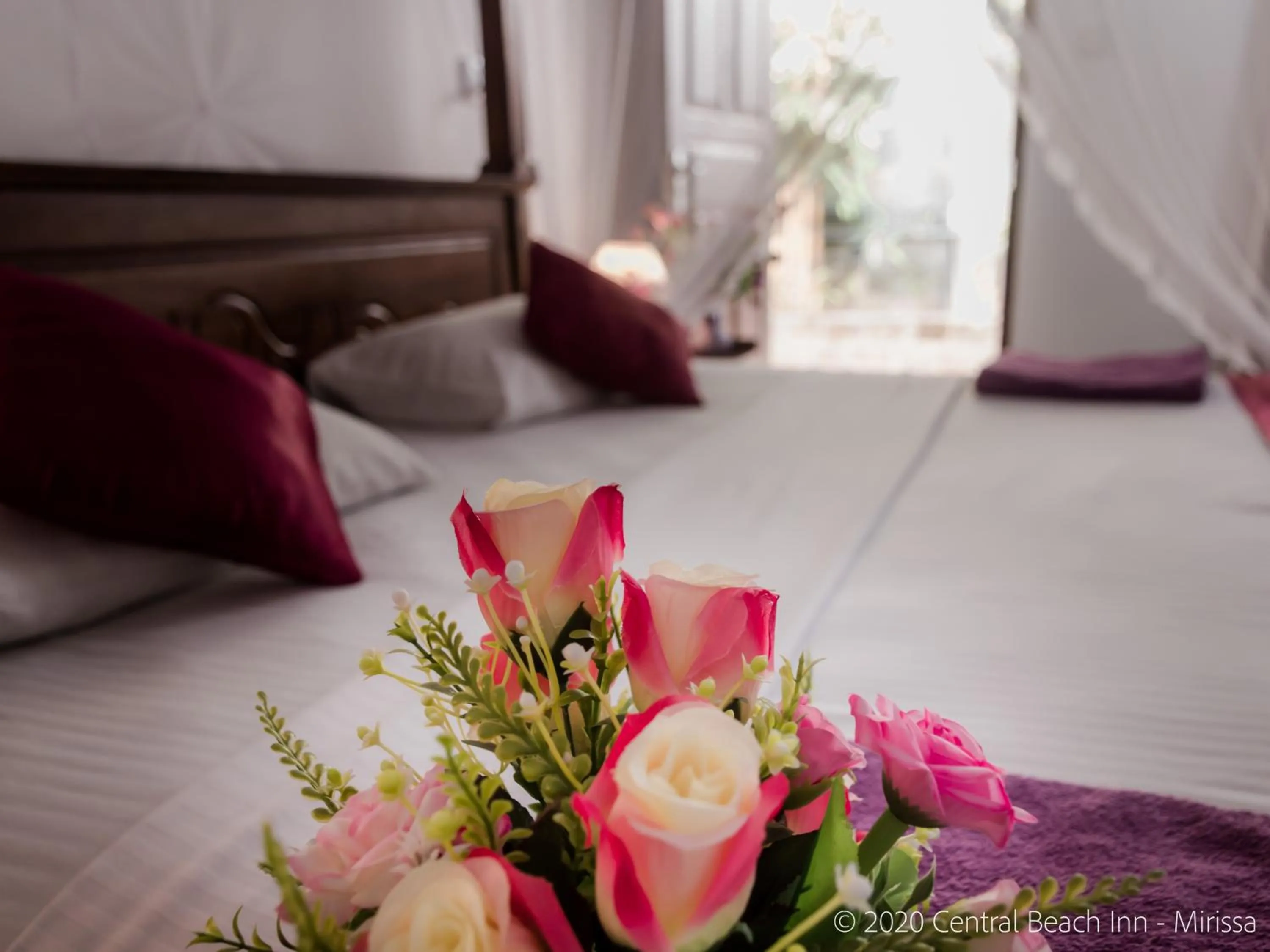 Bed in Central Beach Inn