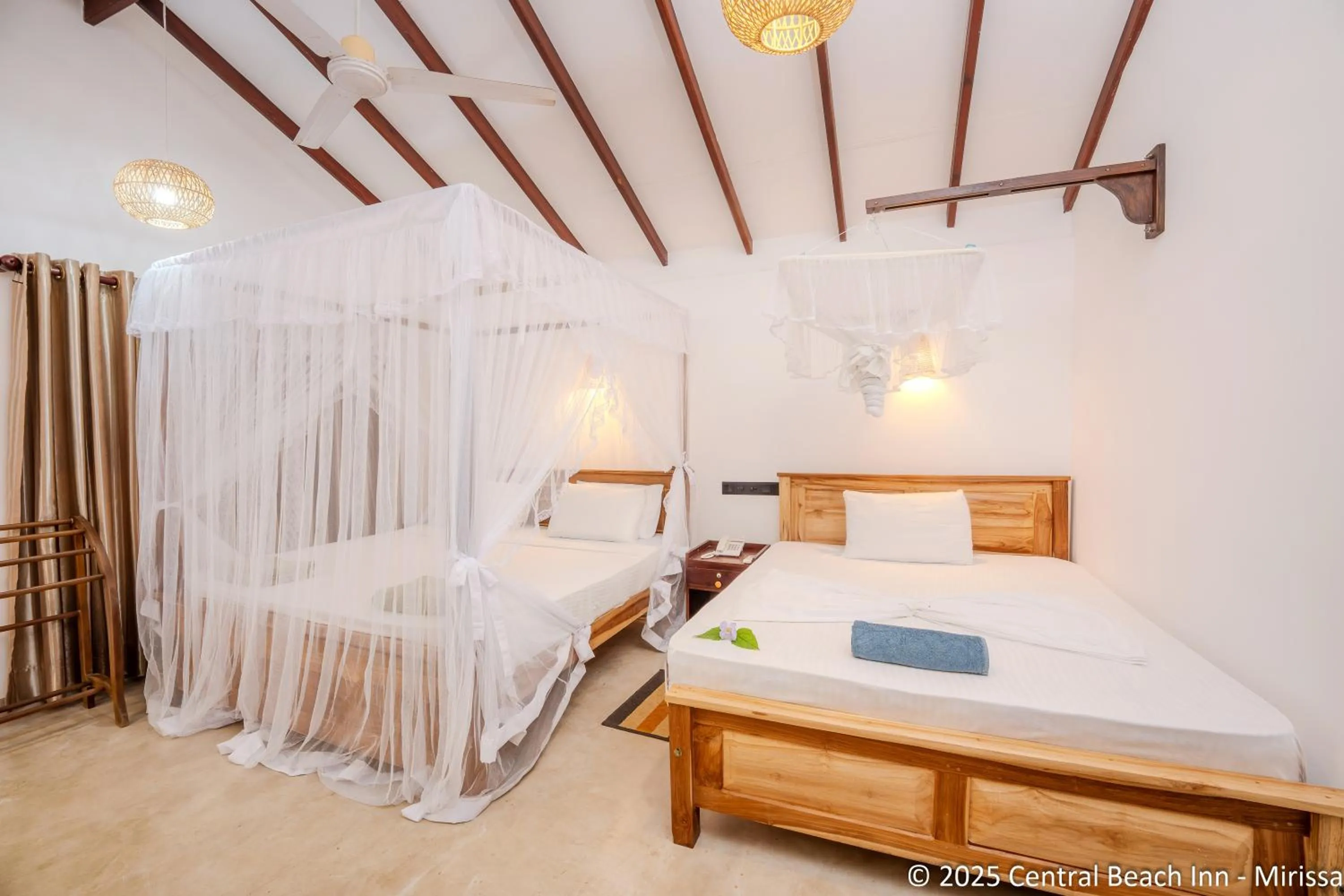 Bed in Central Beach Inn