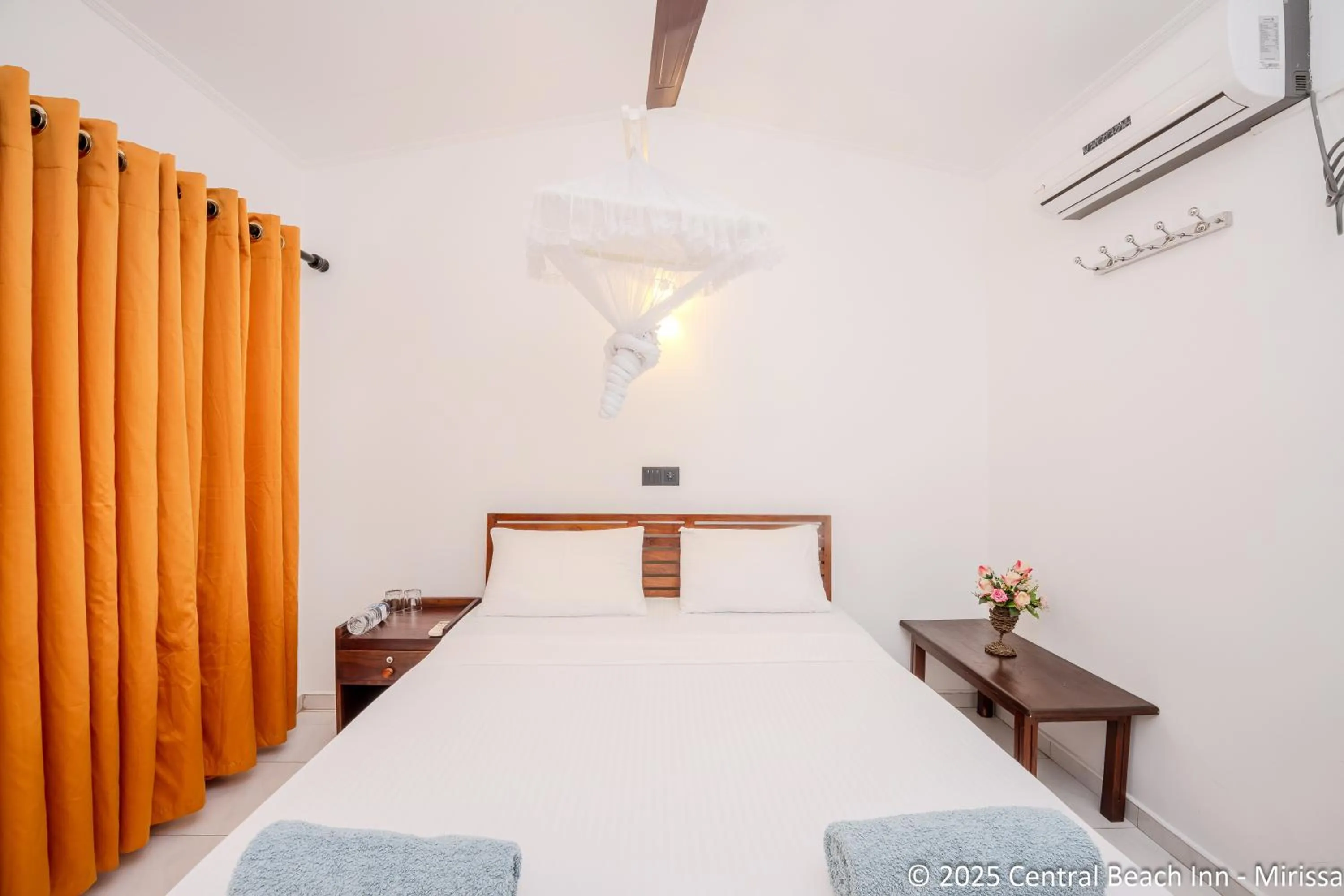 Bed in Central Beach Inn