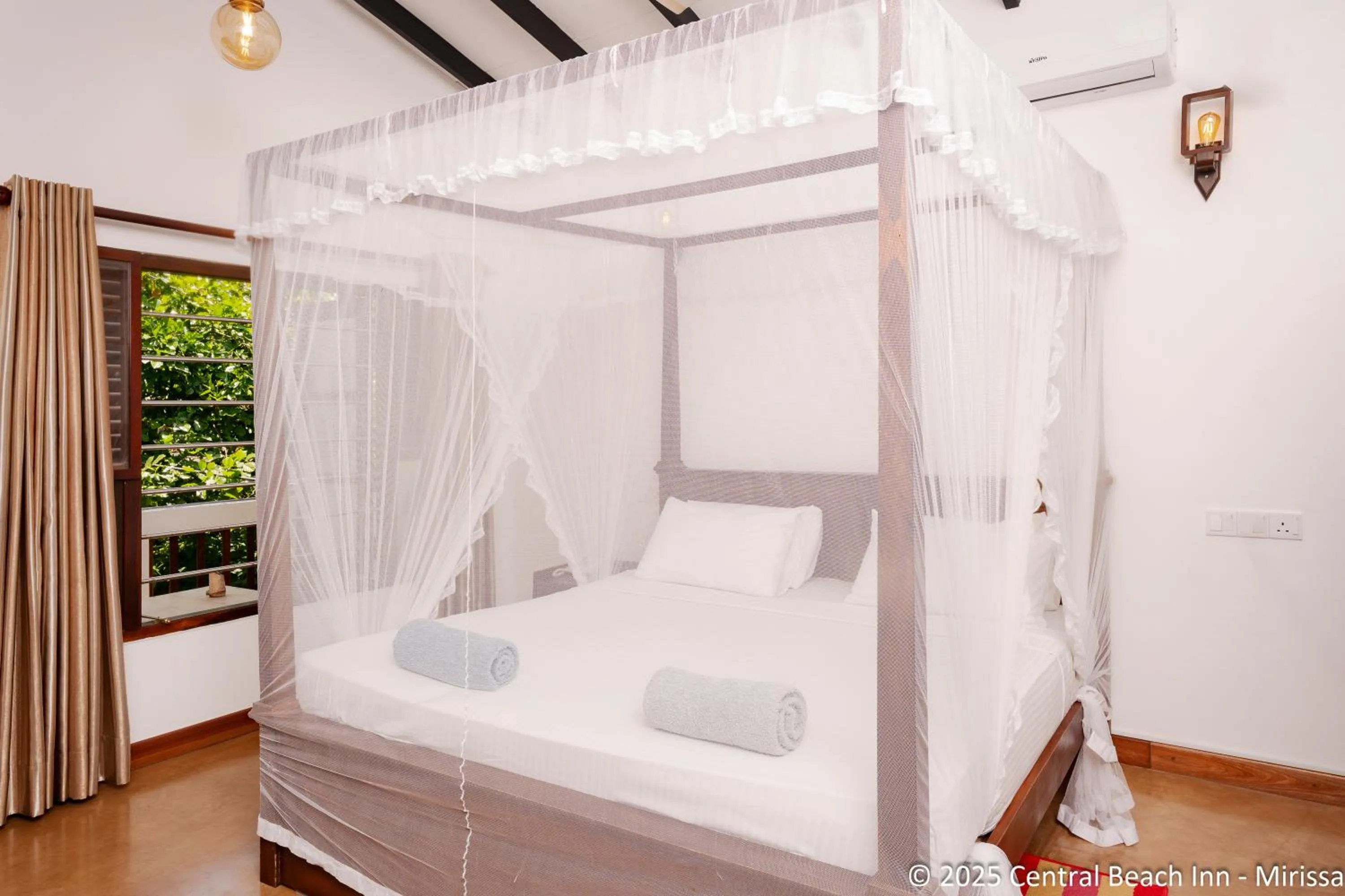 Bed in Central Beach Inn