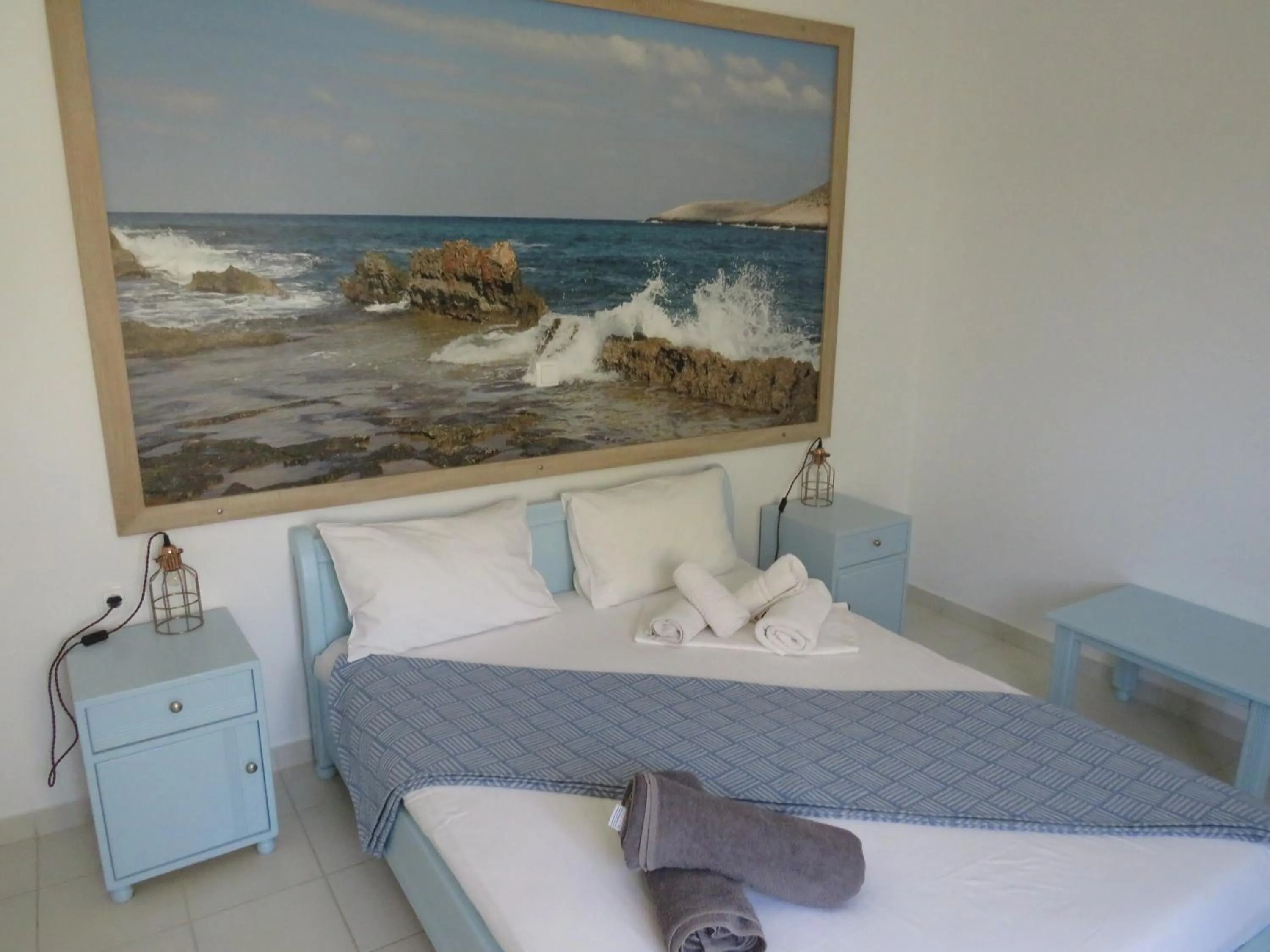 Bed in Blue Beach Villas Apartments