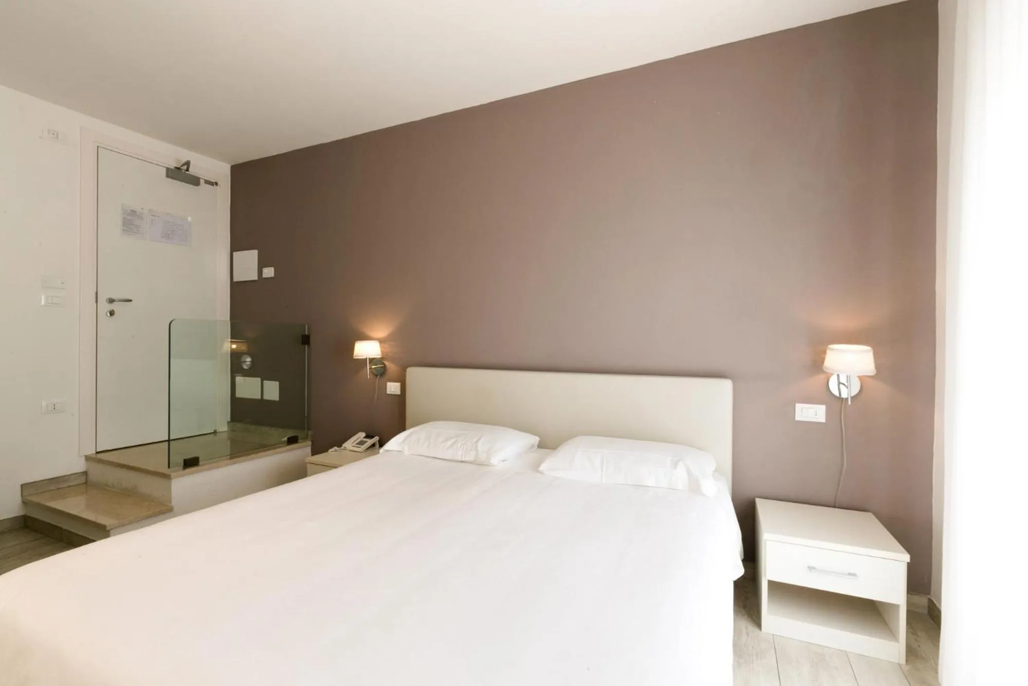 Bed in Hotel Saviola