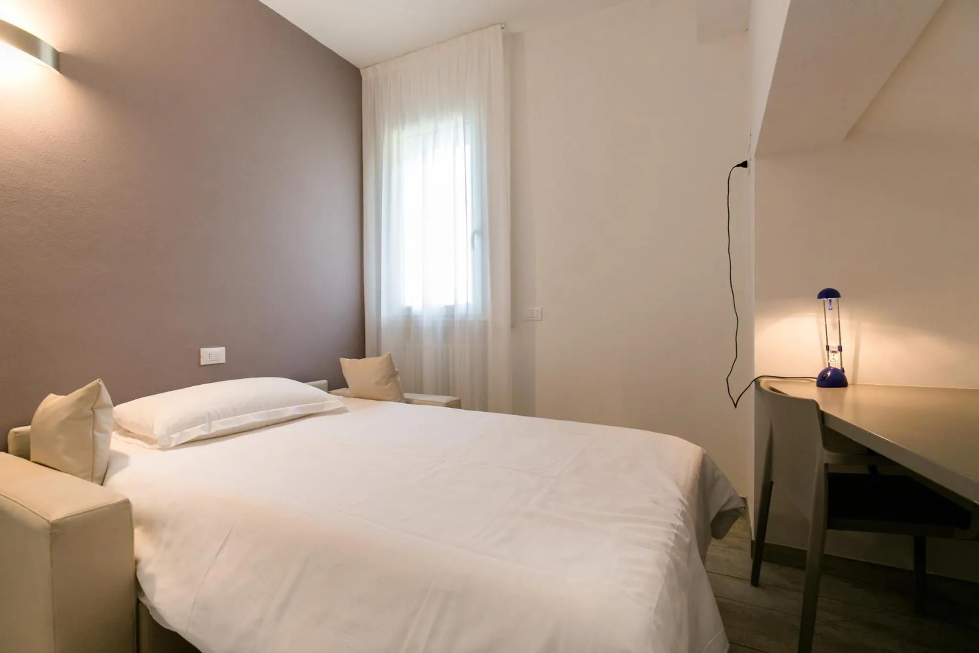 Bed in Hotel Saviola