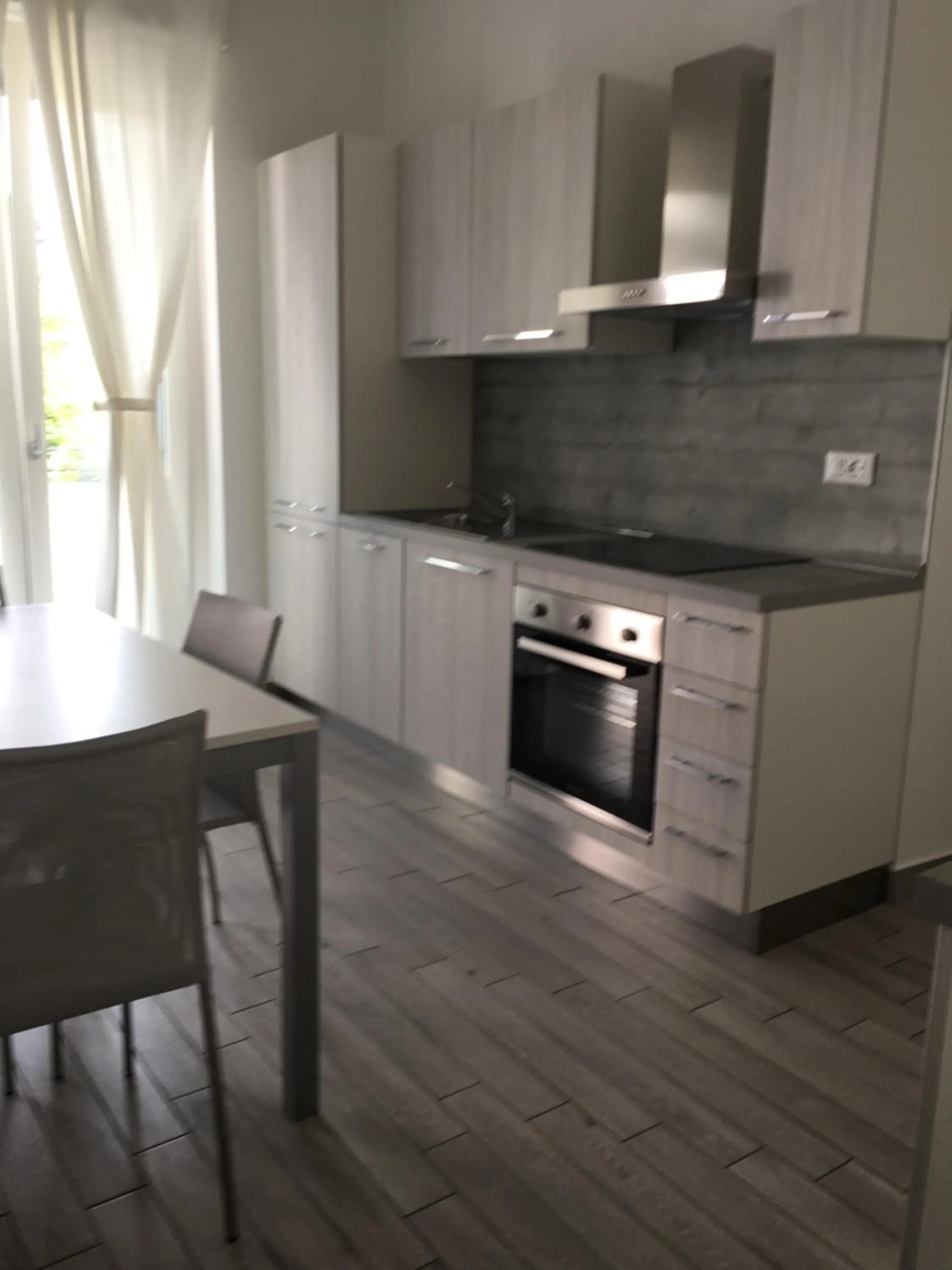 Kitchen or kitchenette in Home Hotel