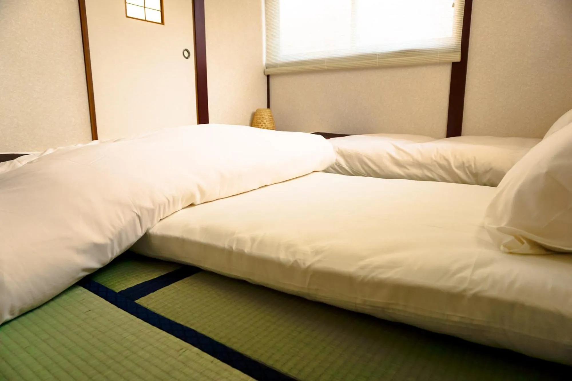 Bed in City Hotel Osaka Nishikujo