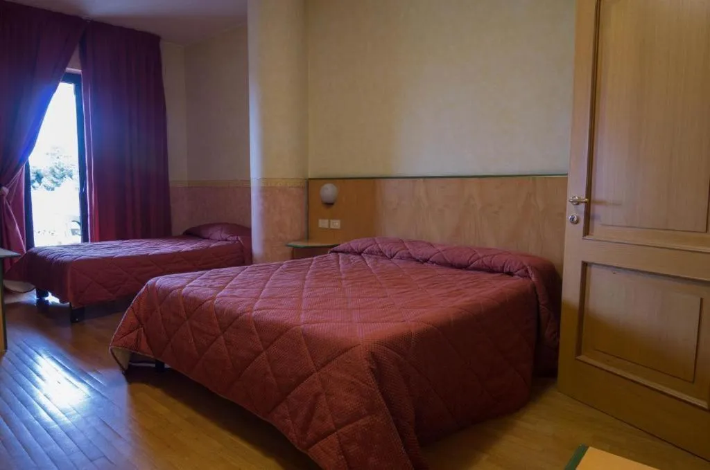 Bed in Hotel Baffo Rosso
