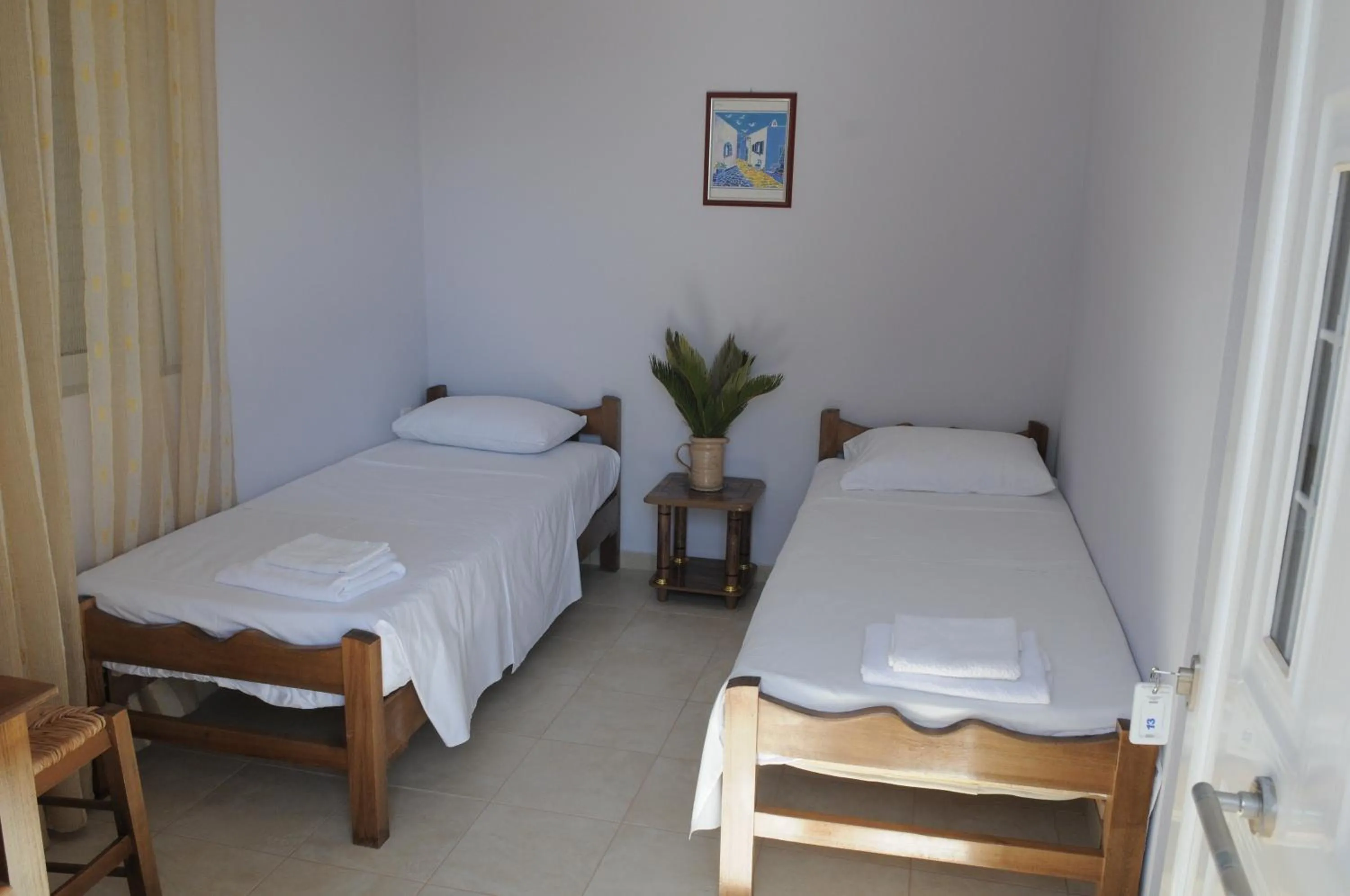 Photo of the whole room, Bed in Olympion Village Studios