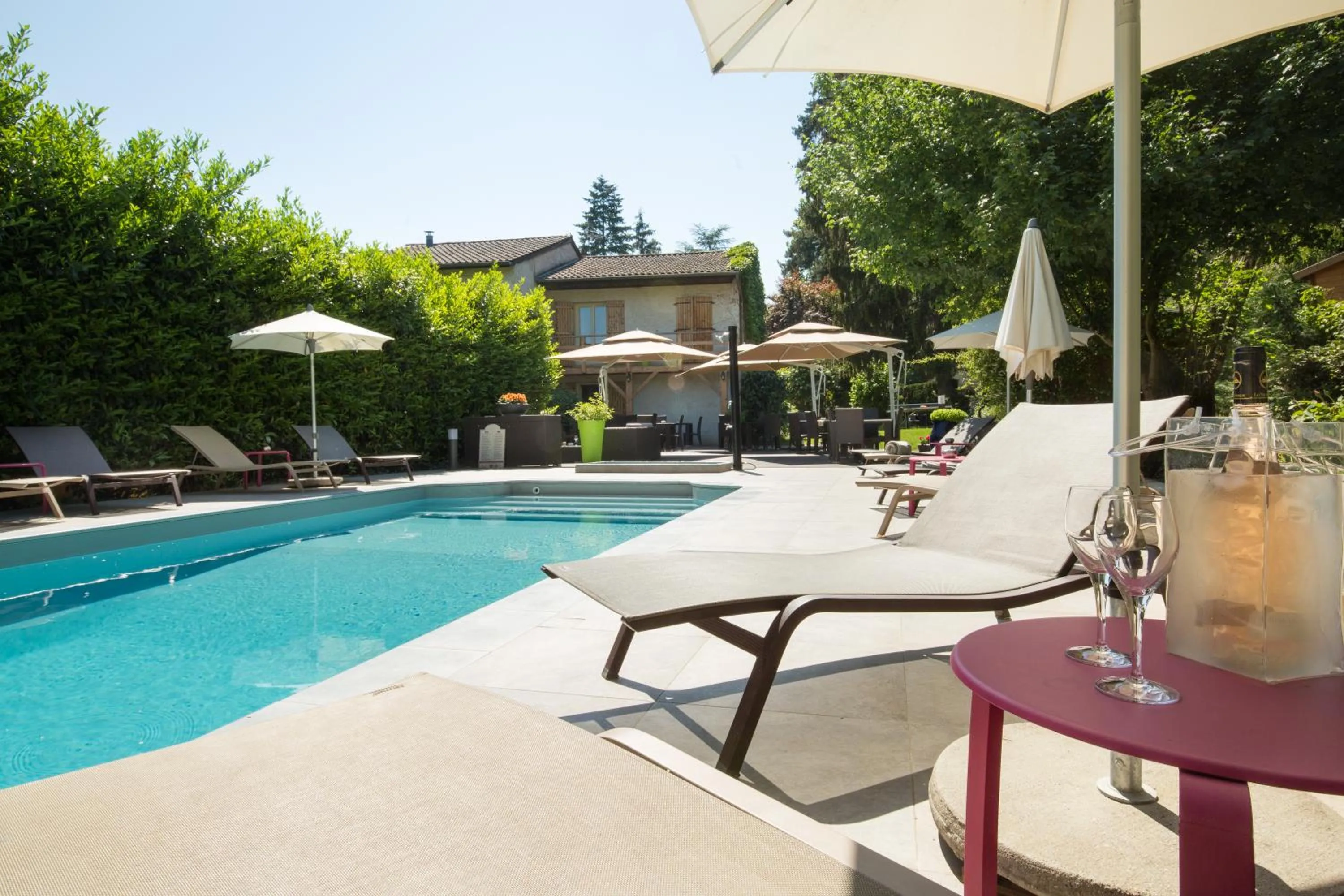 Swimming pool in Logis Hotel Le Petit Casset