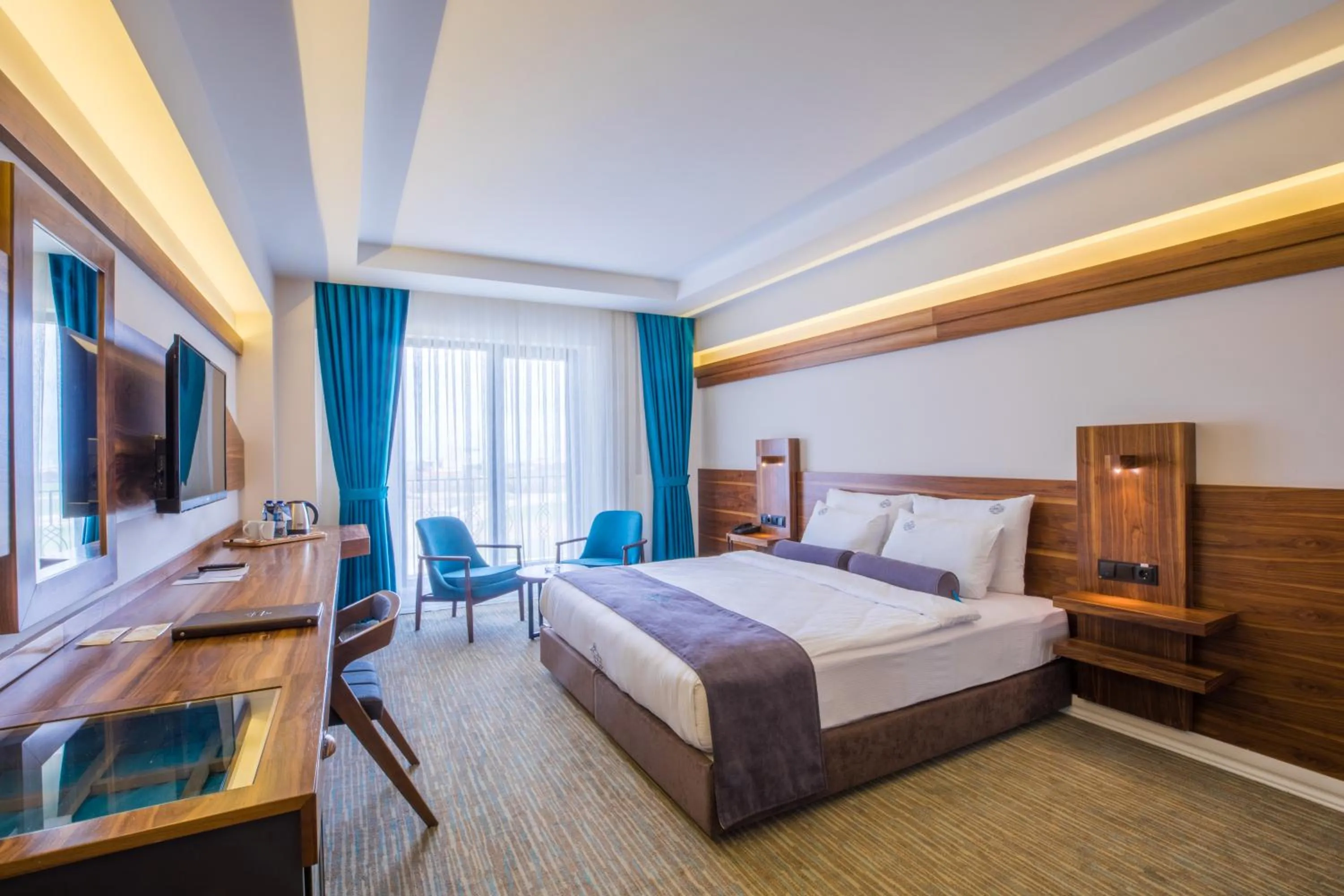 Bed in Karpalas City Hotel & Spa