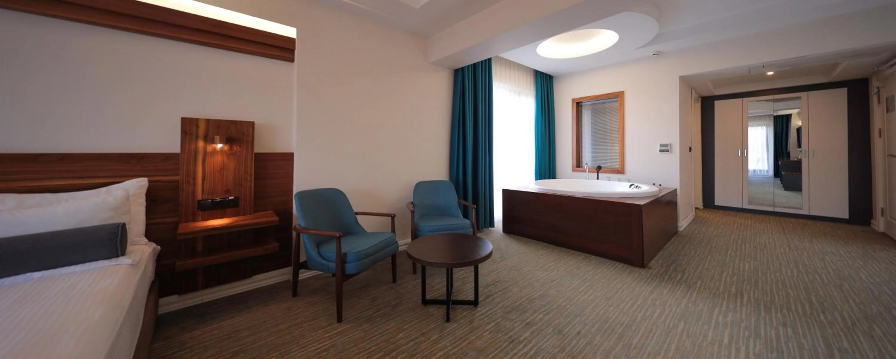 Seating area, Bed in Karpalas City Hotel & Spa