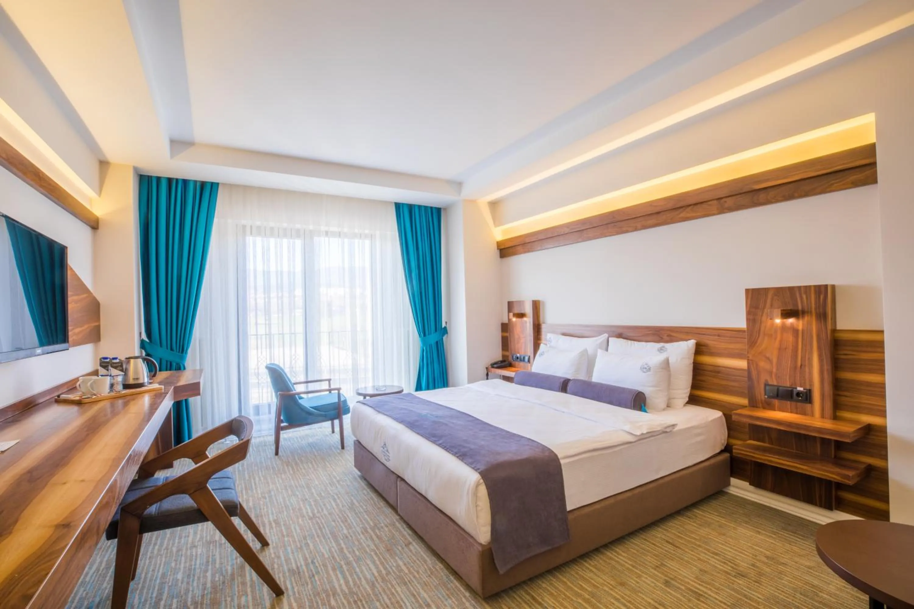 Bed in Karpalas City Hotel & Spa