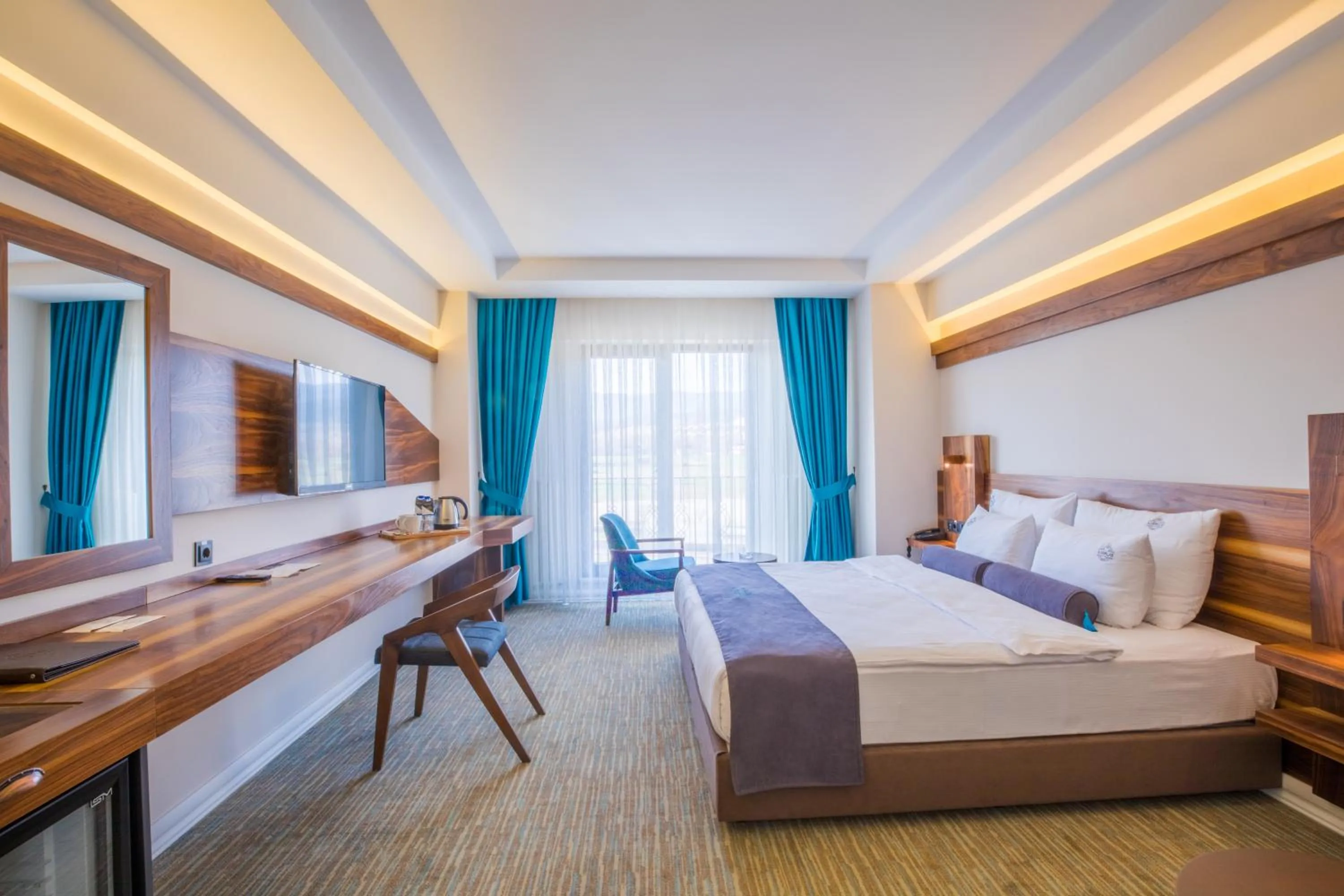 Bed in Karpalas City Hotel & Spa