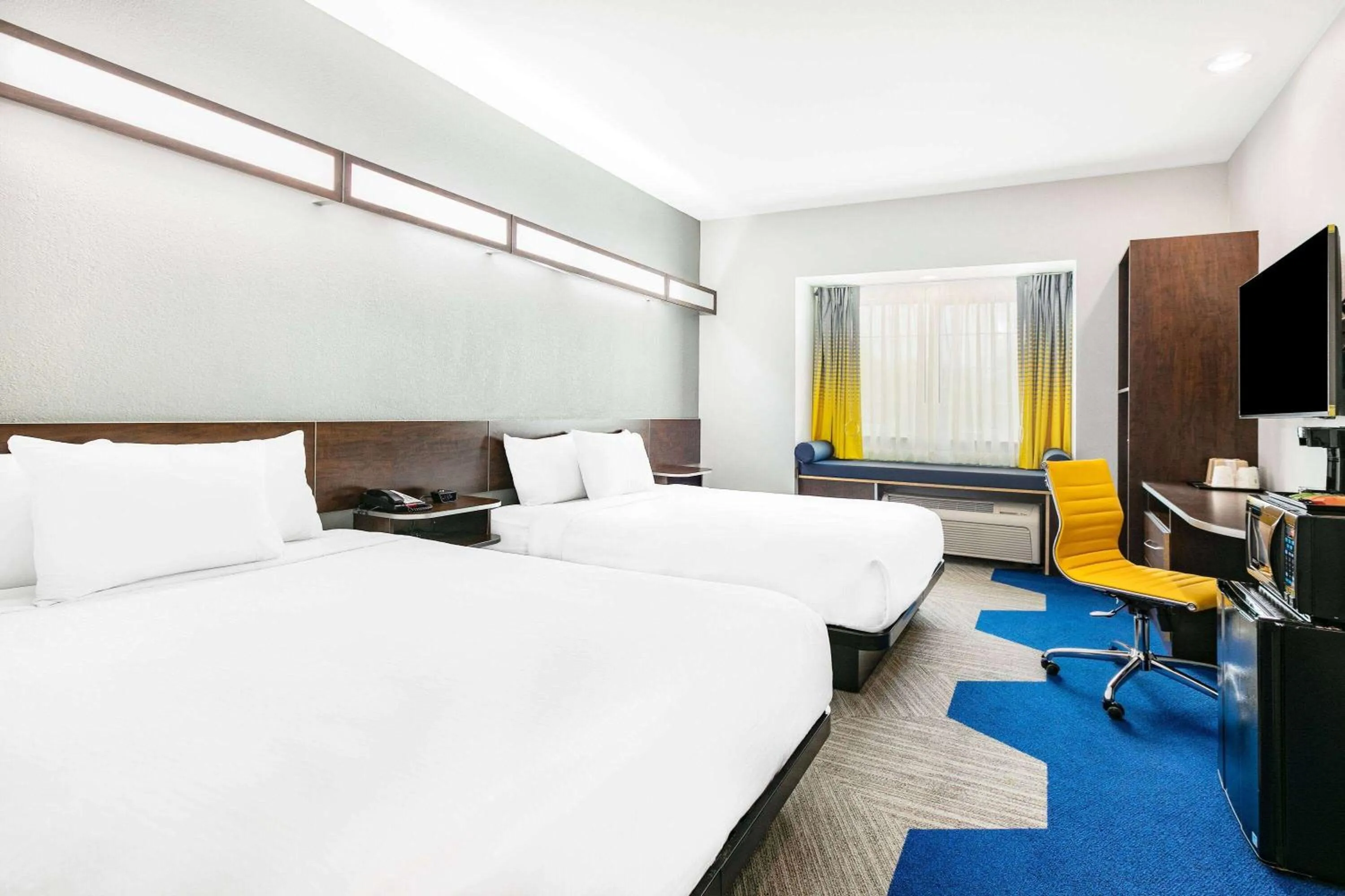 Bed in Microtel Inn & Suites by Wyndham Austin Airport
