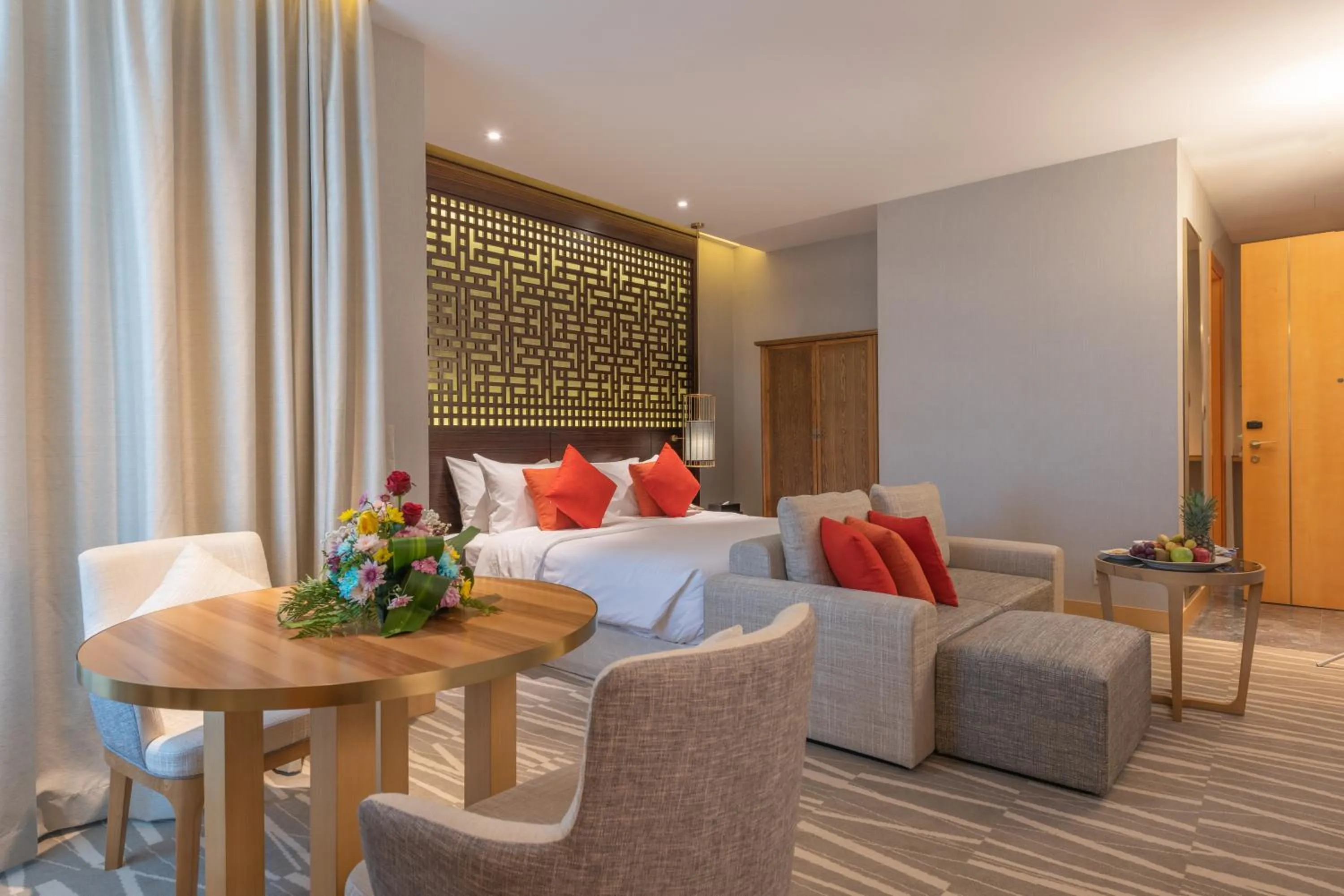 Seating area, Bed in Ramada Hotel & Suites by Wyndham Al Qassim