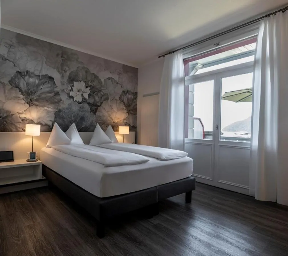 Bed in Hotel Vitznauerhof - Lifestyle Hideaway at Lake Lucerne